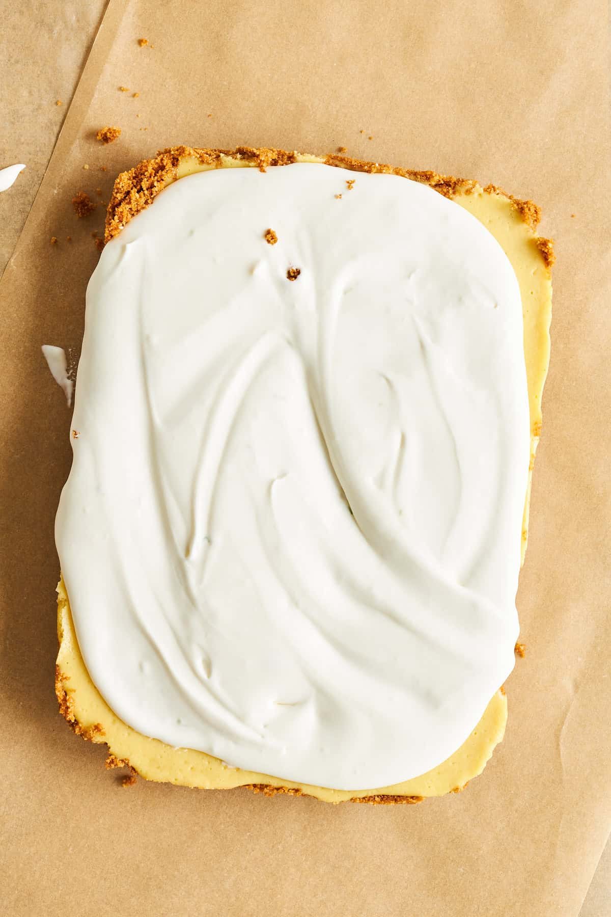 A slab of key lime pie layers.