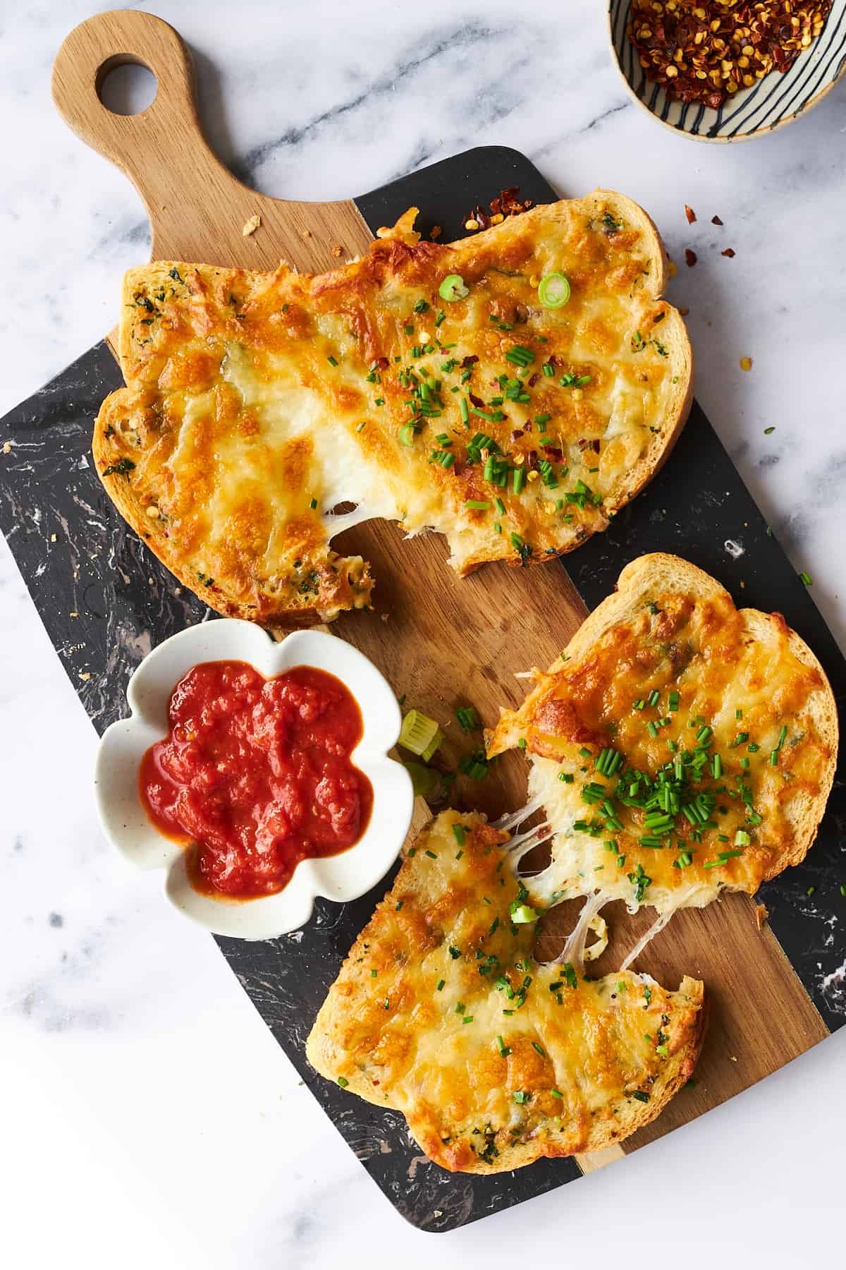 Air fryer cheesy garlic toast on a platter.