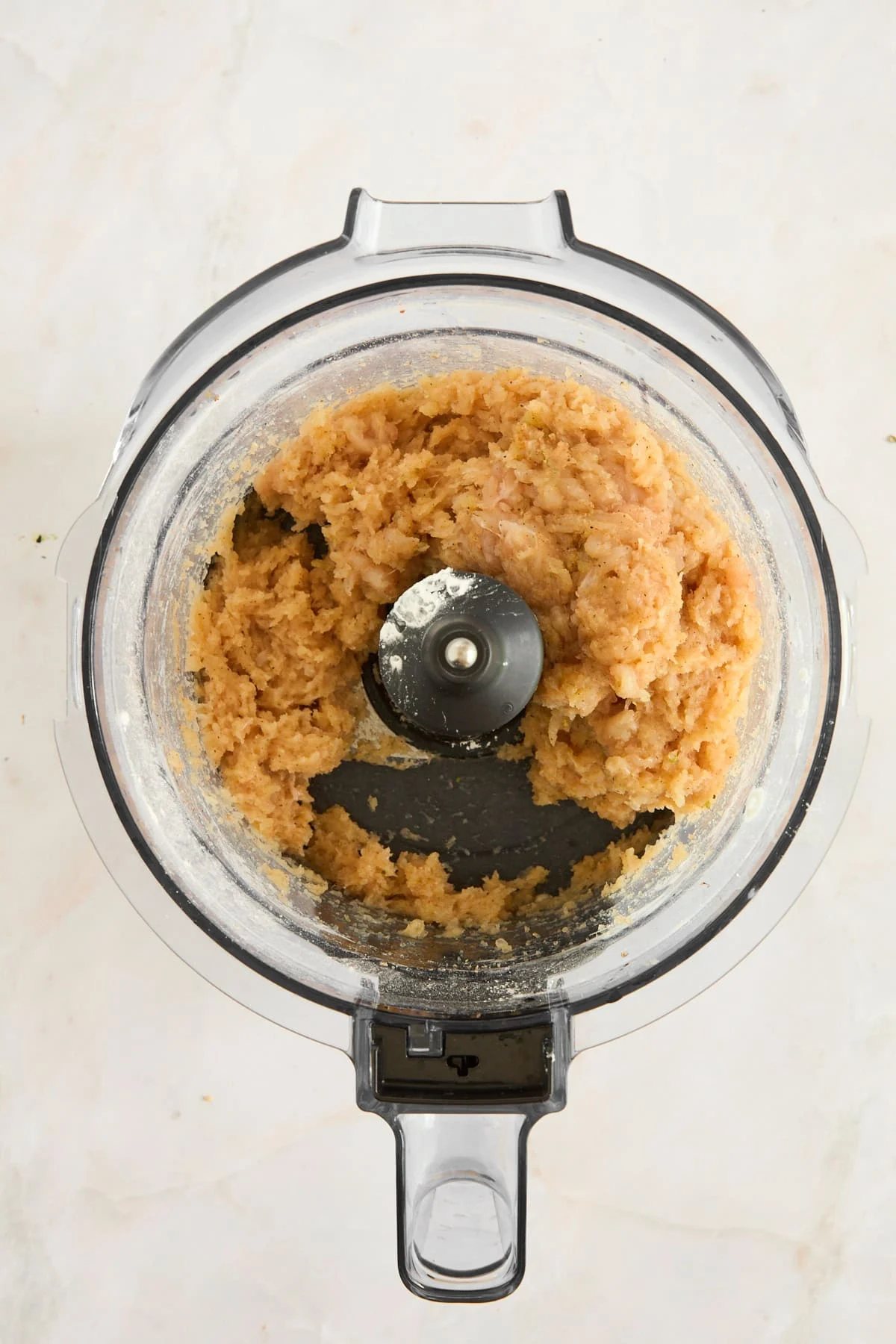 A chicken nugget mixture in a food processor.
