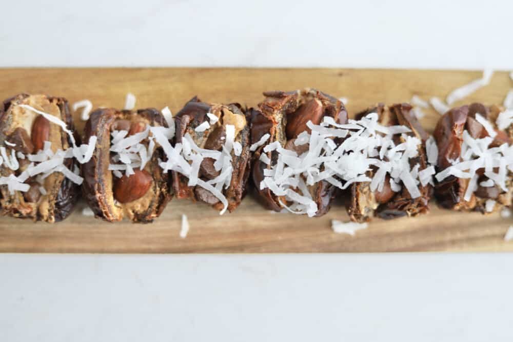 dates stuffed with nut butter, almonds, chocolate chips, and coconut flakes