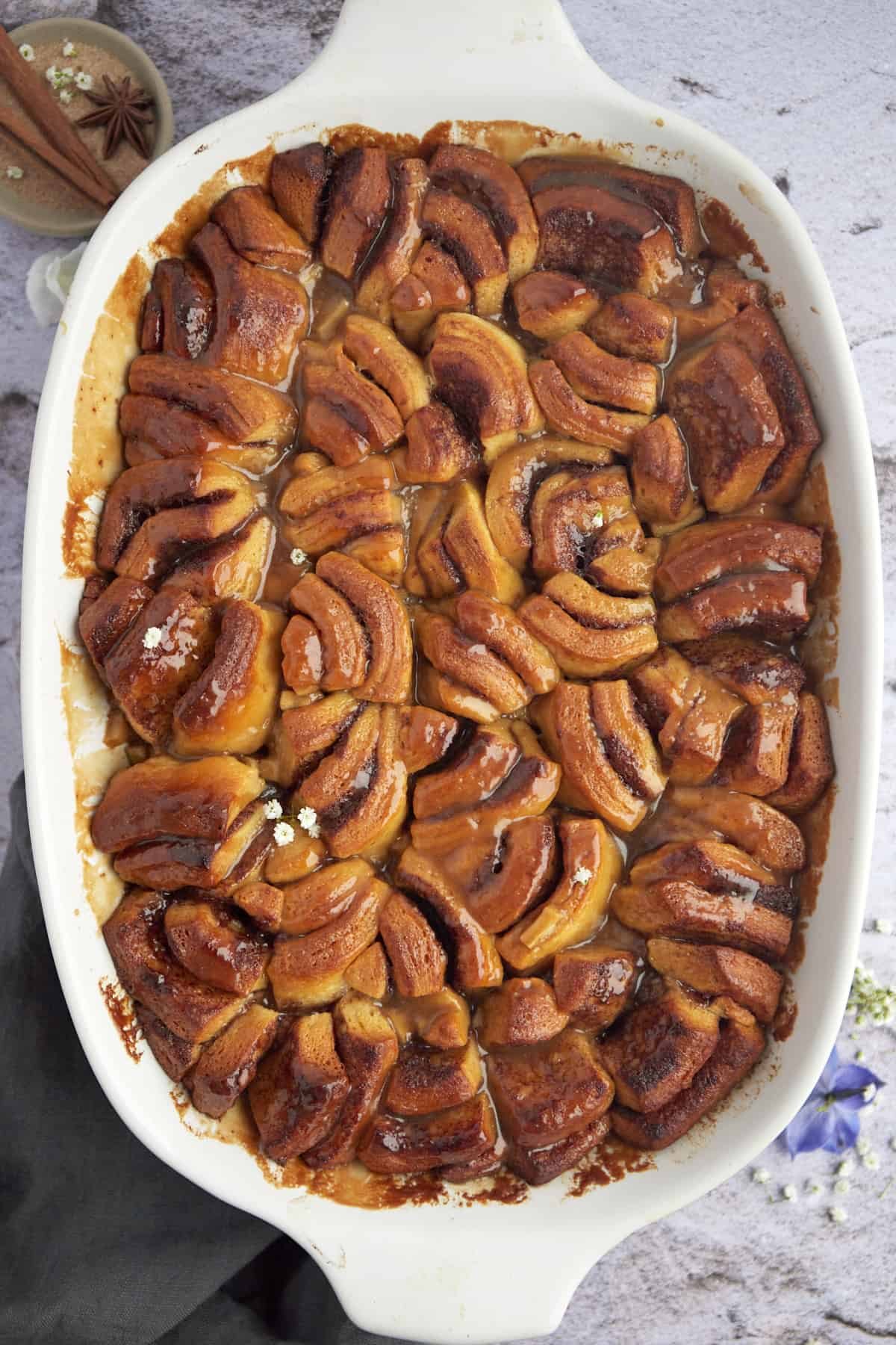 overhead image of baked apple caramel cinnamon rolls