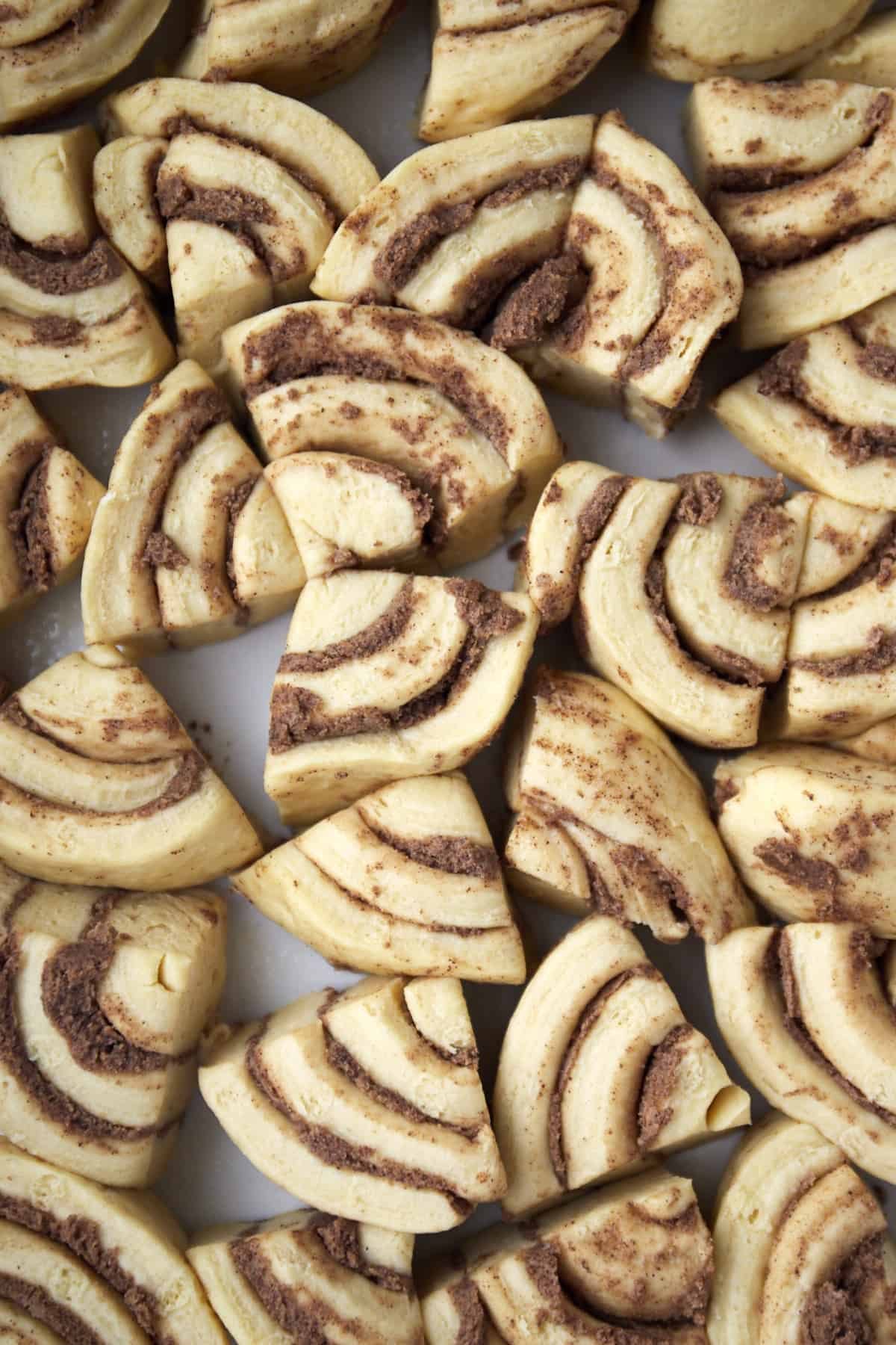 quartered cinnamon roll dough