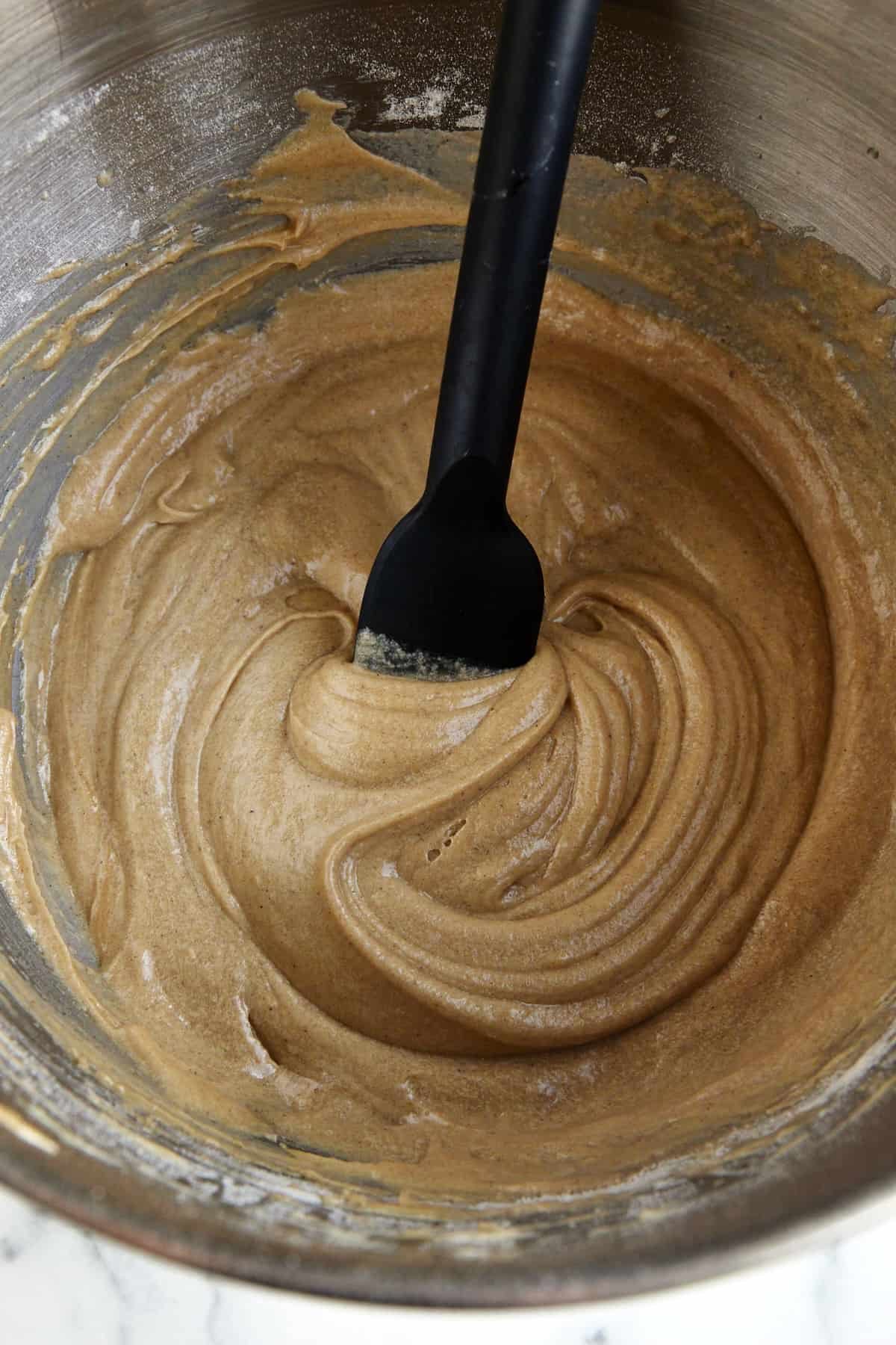 Apple cider muffin batter in a bowl.