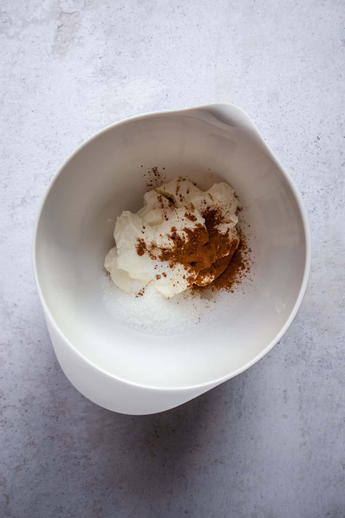cream cheese, sugar, and cinnamon in a bowl