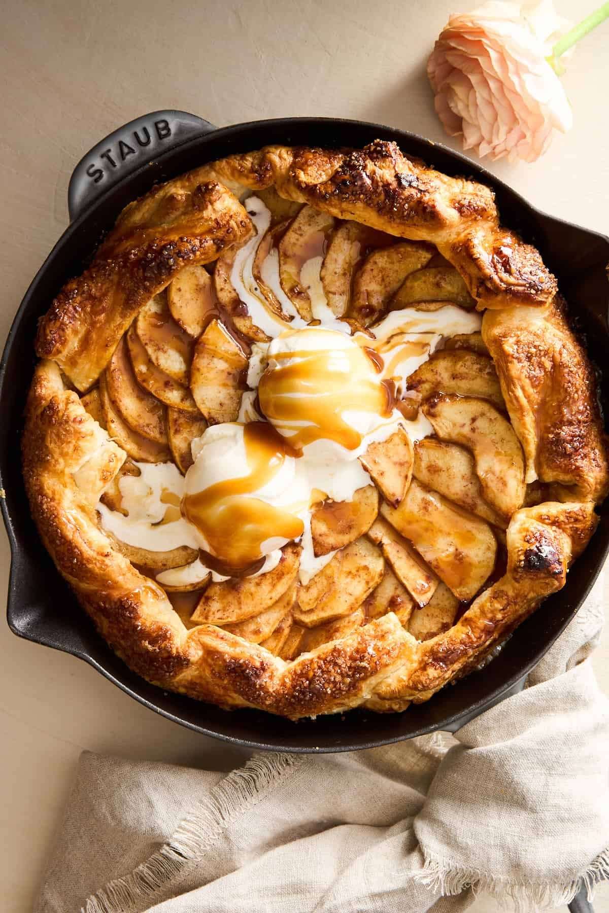 Apple Galette with Puff Pastry topped with vanilla ice cream and caramel.