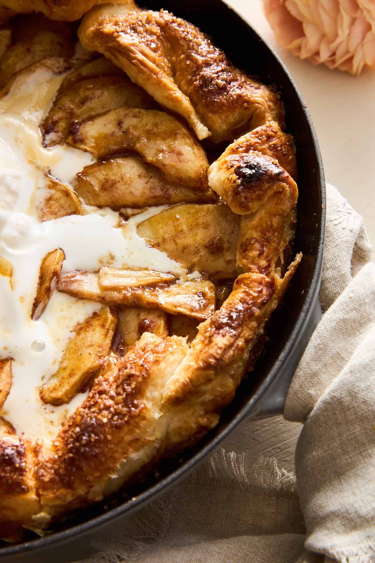 Close up image of Apple Galette with Puff Pastry topped with ice cream and caramel.