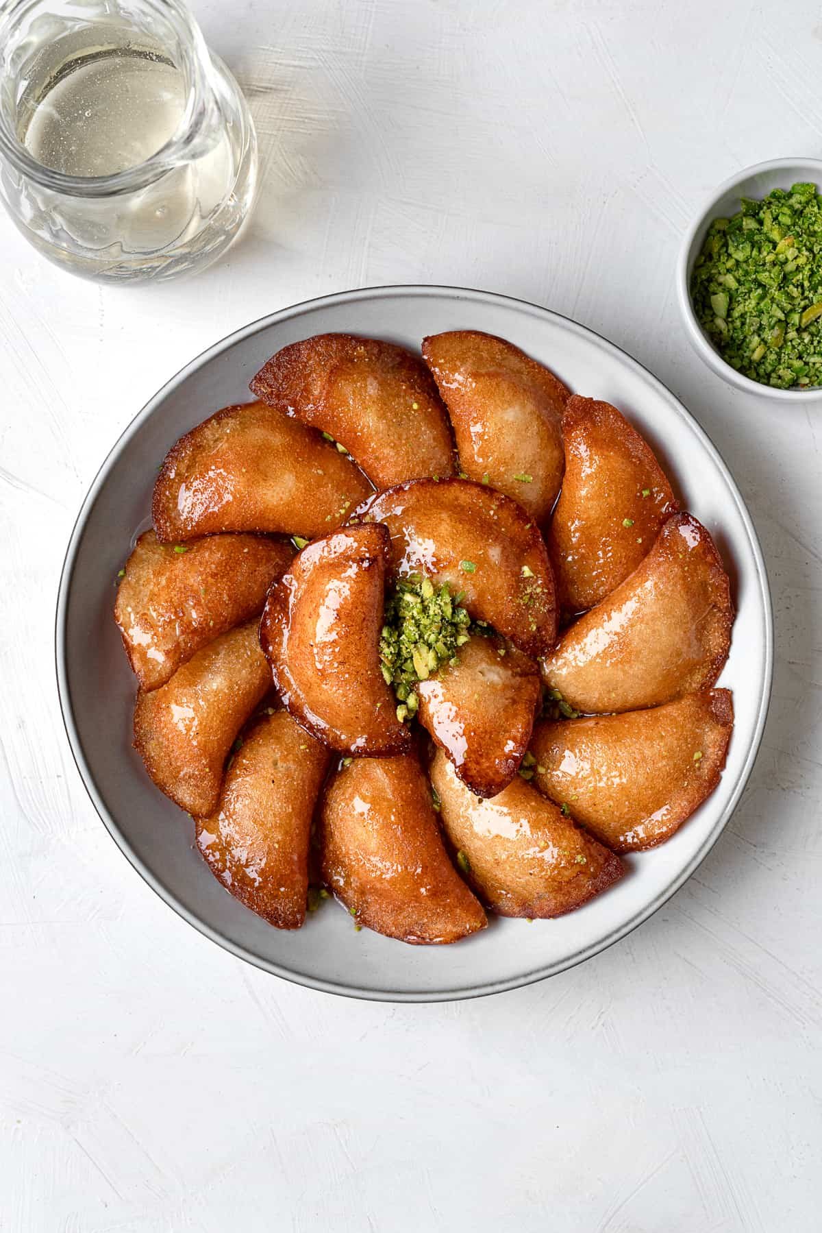 overhead atayef on platter with pistachios