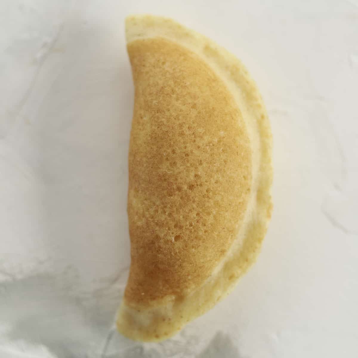 folded atayef stuffed with cream cheese