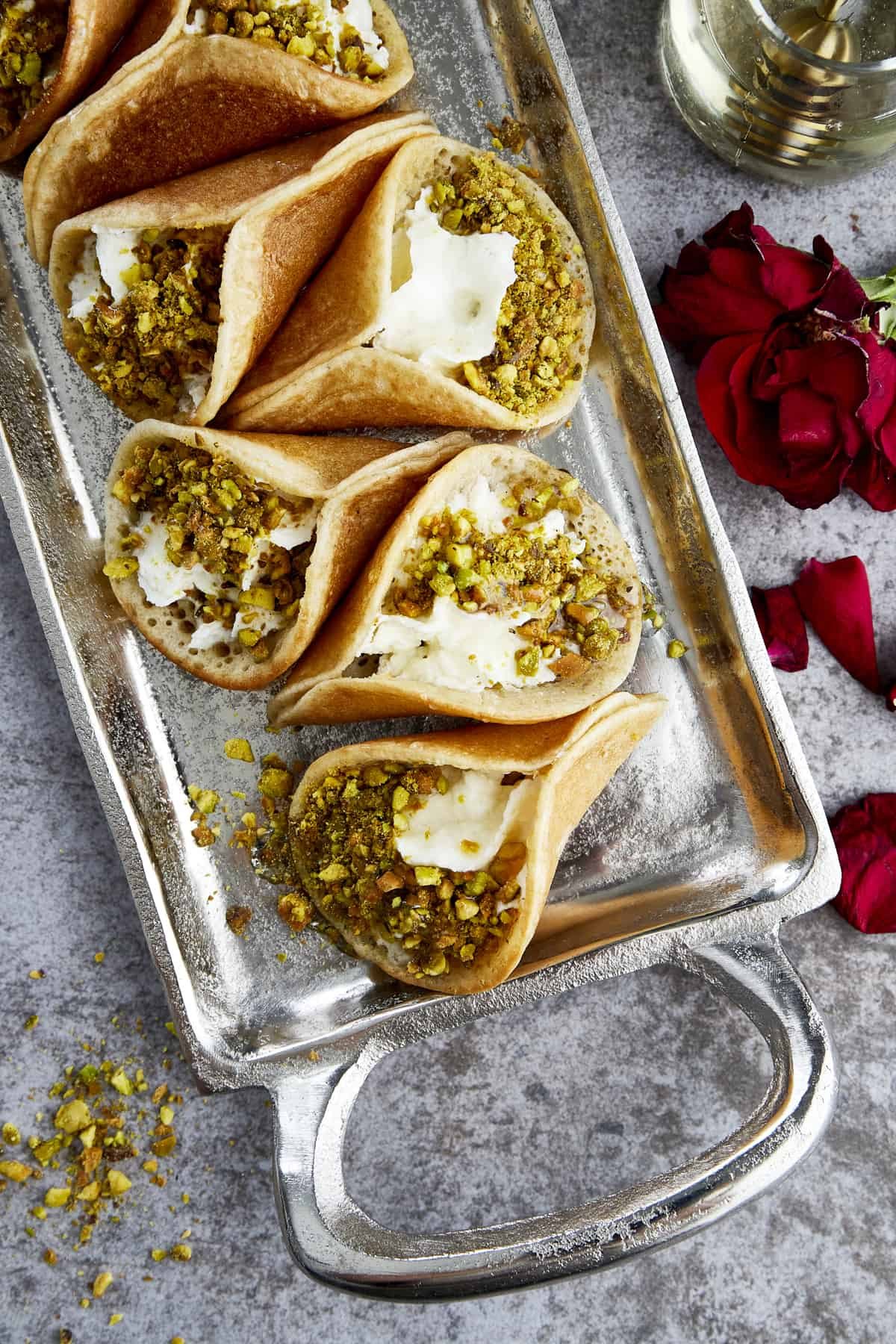 Atayef with Whipped Cream and Pistachios at the Table