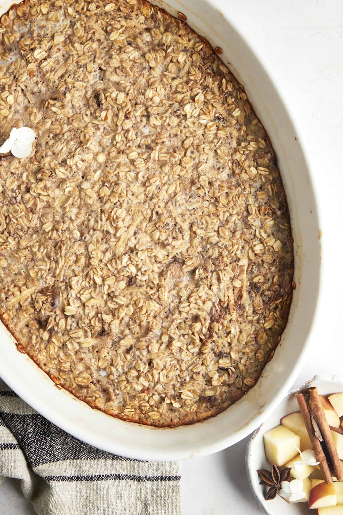 Baked apple oatmeal in an oval baking dish.