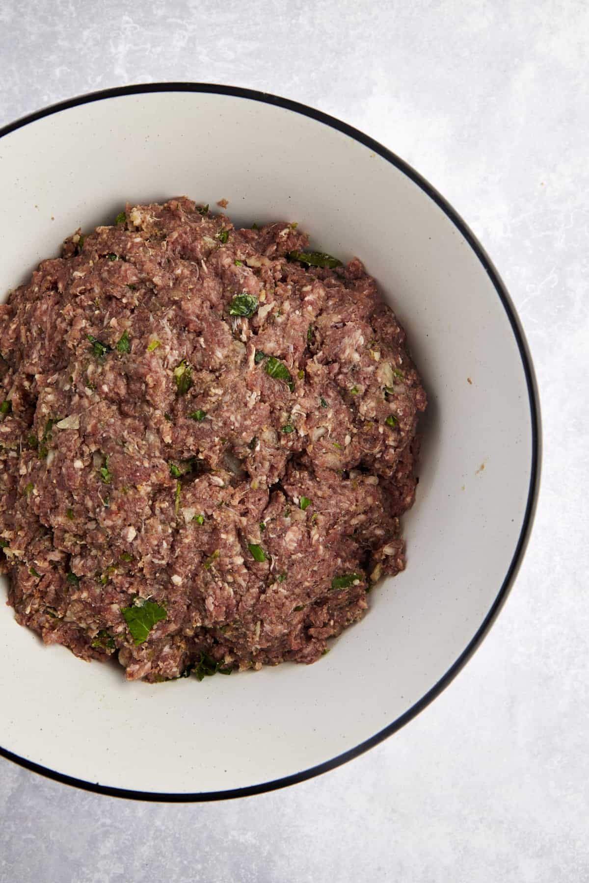 A raw beef kofta mixture in a bowl.
