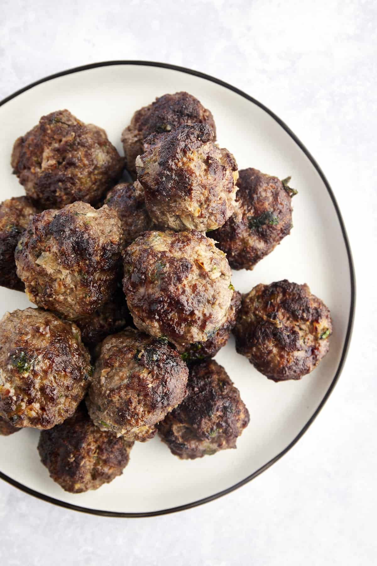 Beef kofta meatballs on a plate.