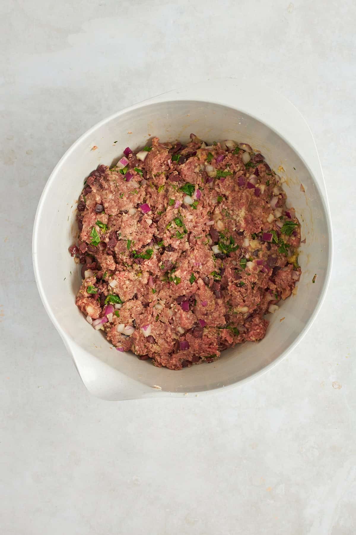 Mediterranean ground beef meatball mixture in a bowl.