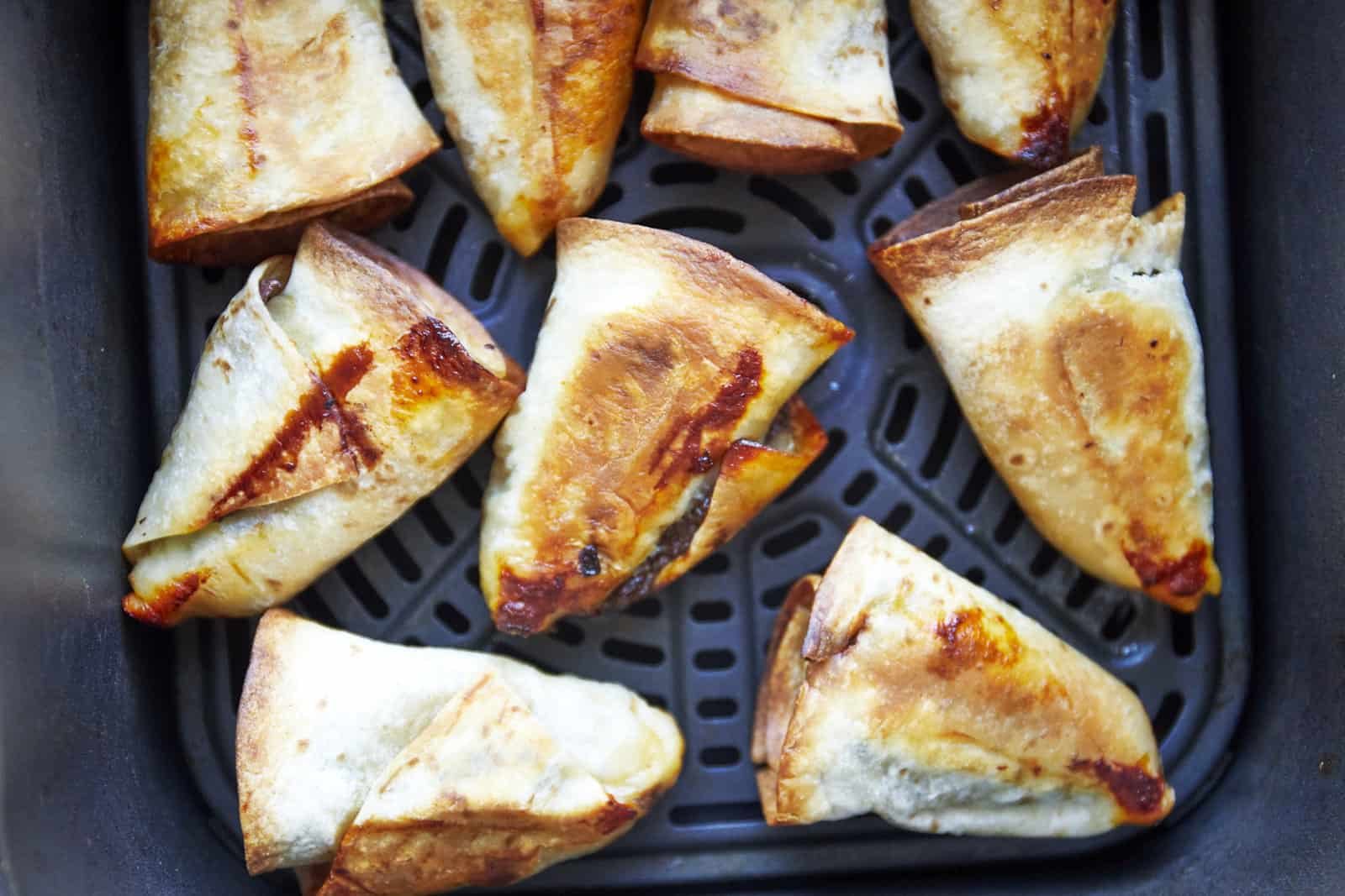 Beef rolls in an air fryer.
