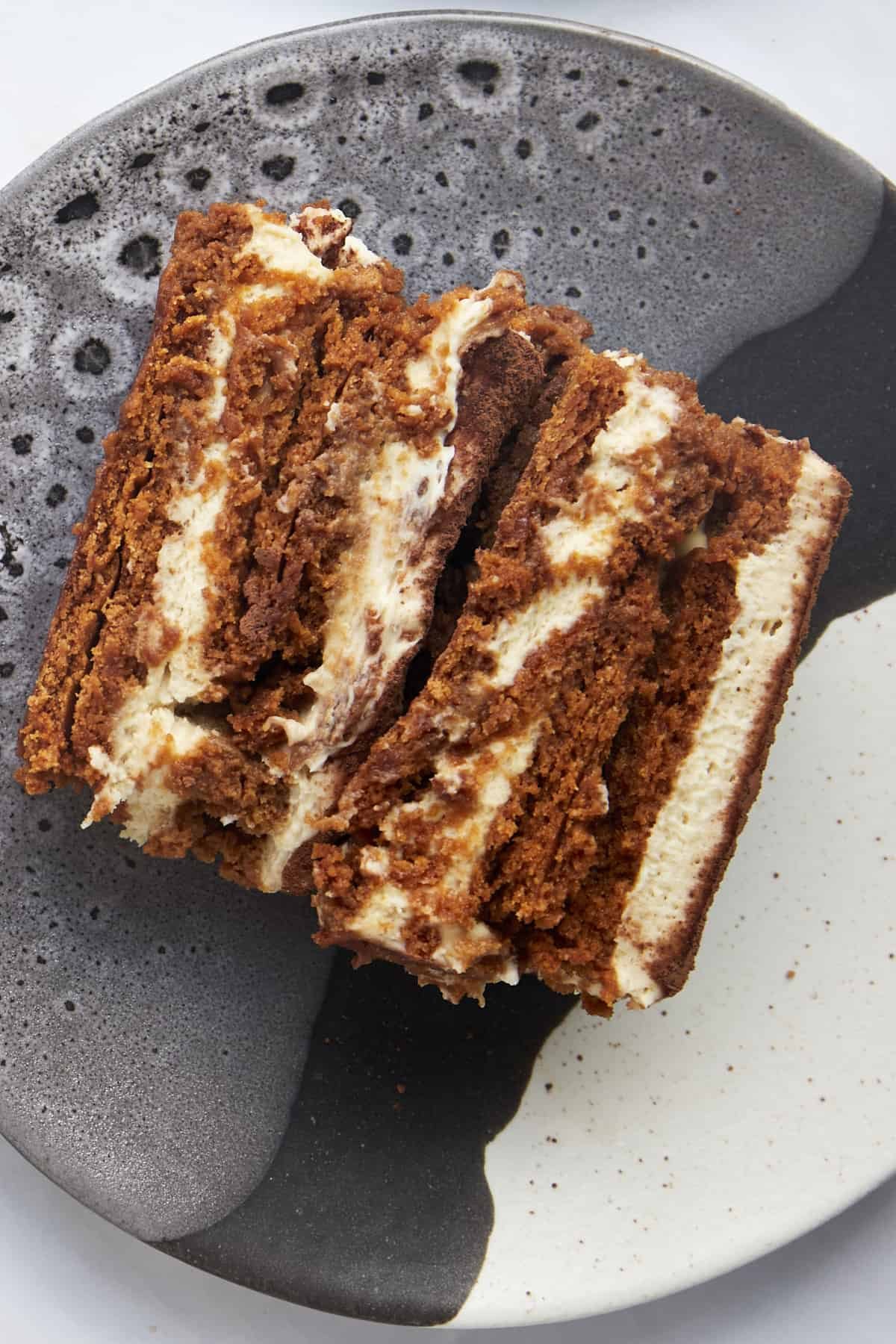 Close up image of a slice of Biscoff tiramisu on a plate.