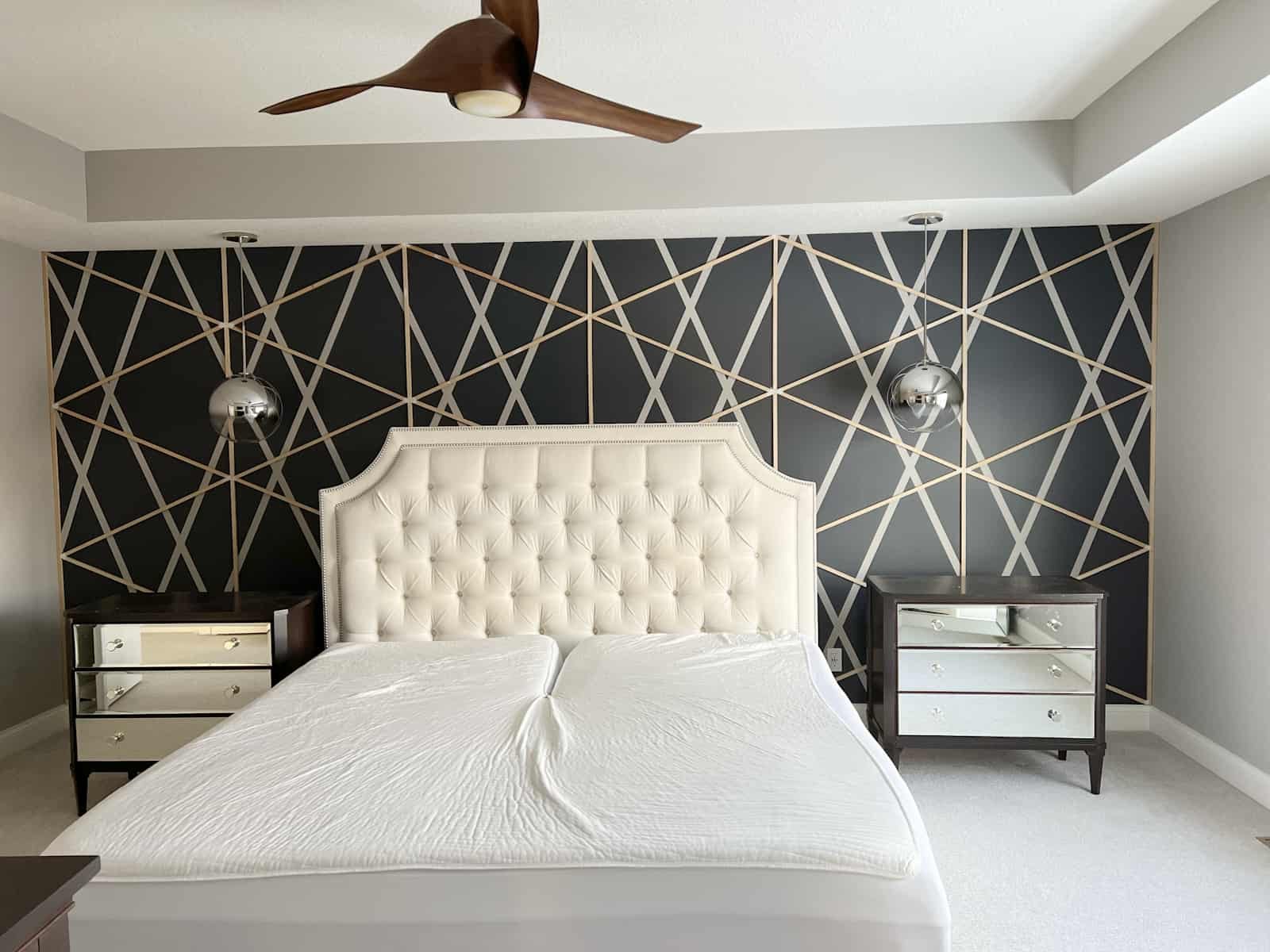 An accent wall with geometrical shapes.