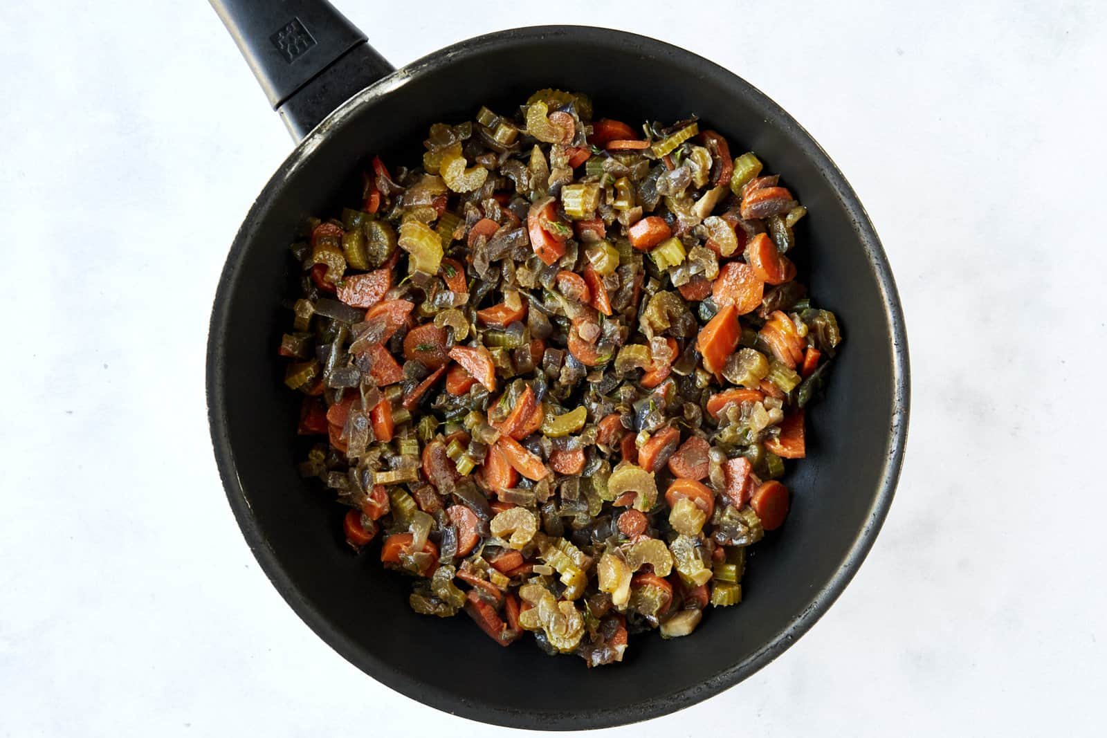 Sautéed veggies in a skillet.