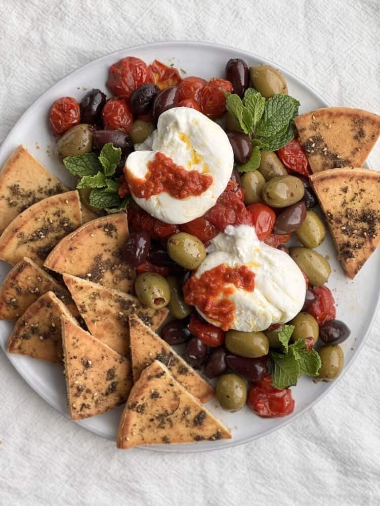 burrata with roasted tomatoes, olives and zaatar pita
