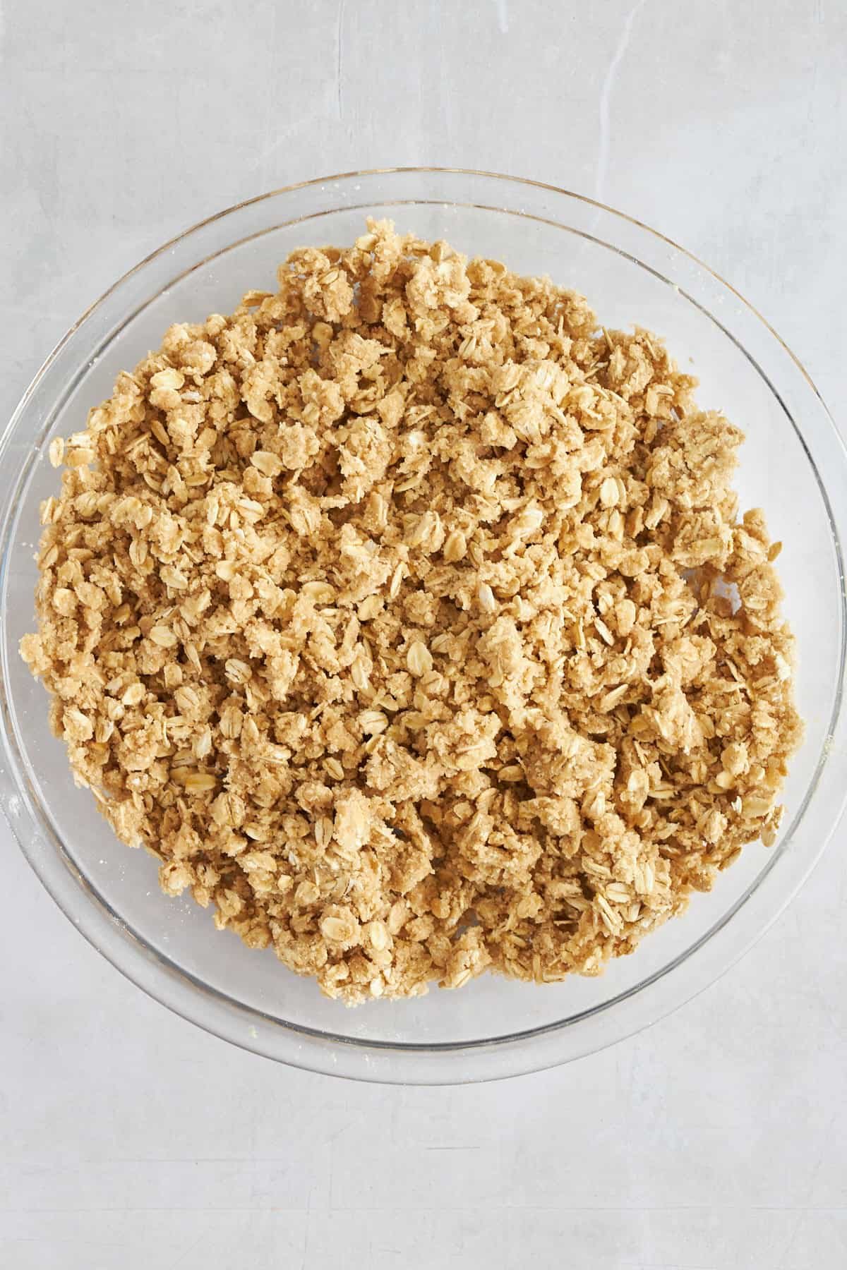 A bowl of oat crumble topping.