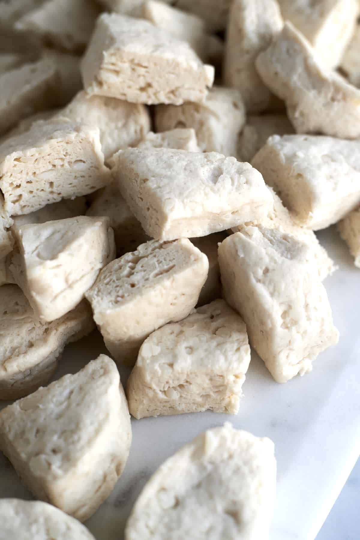 raw quartered biscuit pieces.