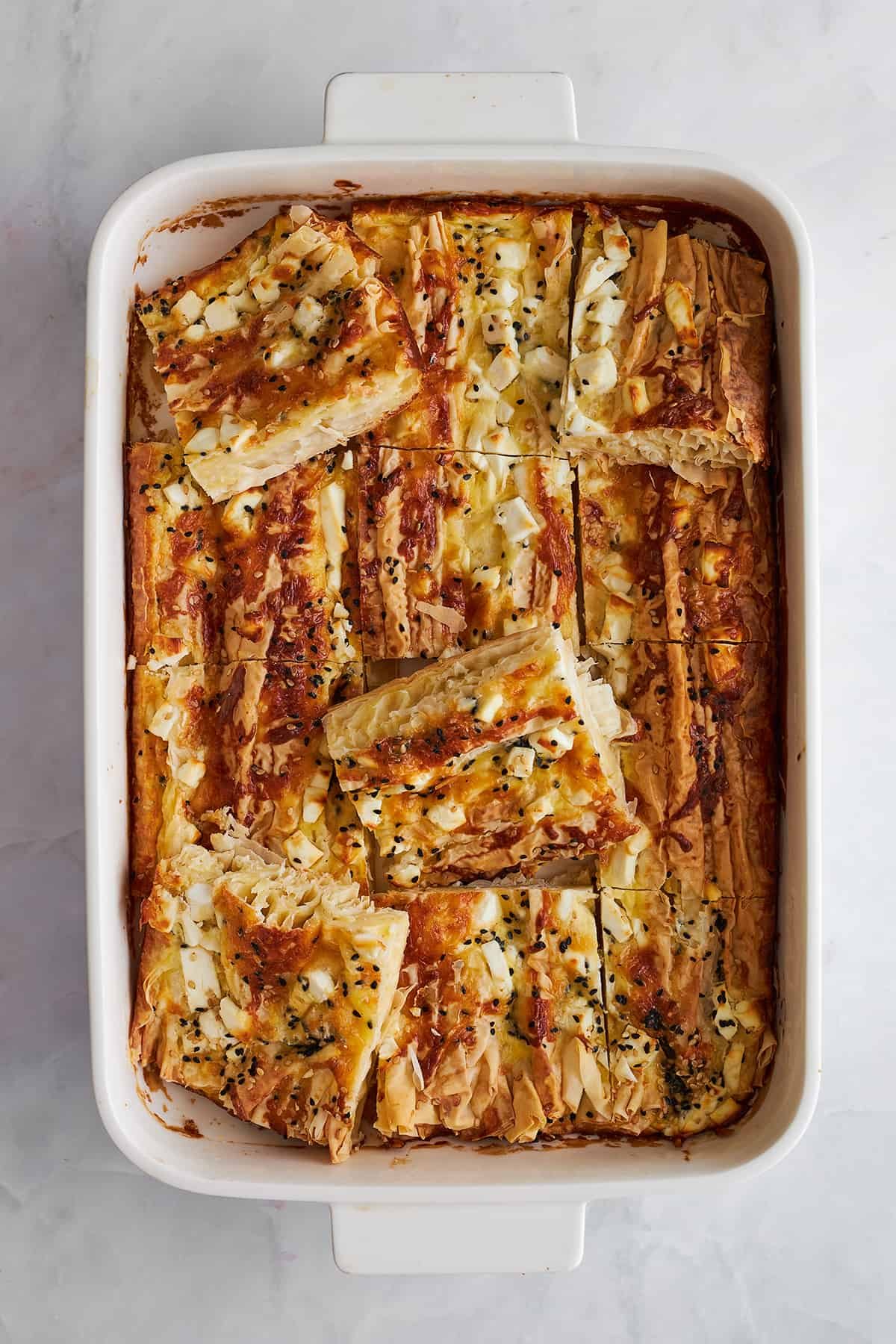 Feta cheese phyllo cut into squares.
