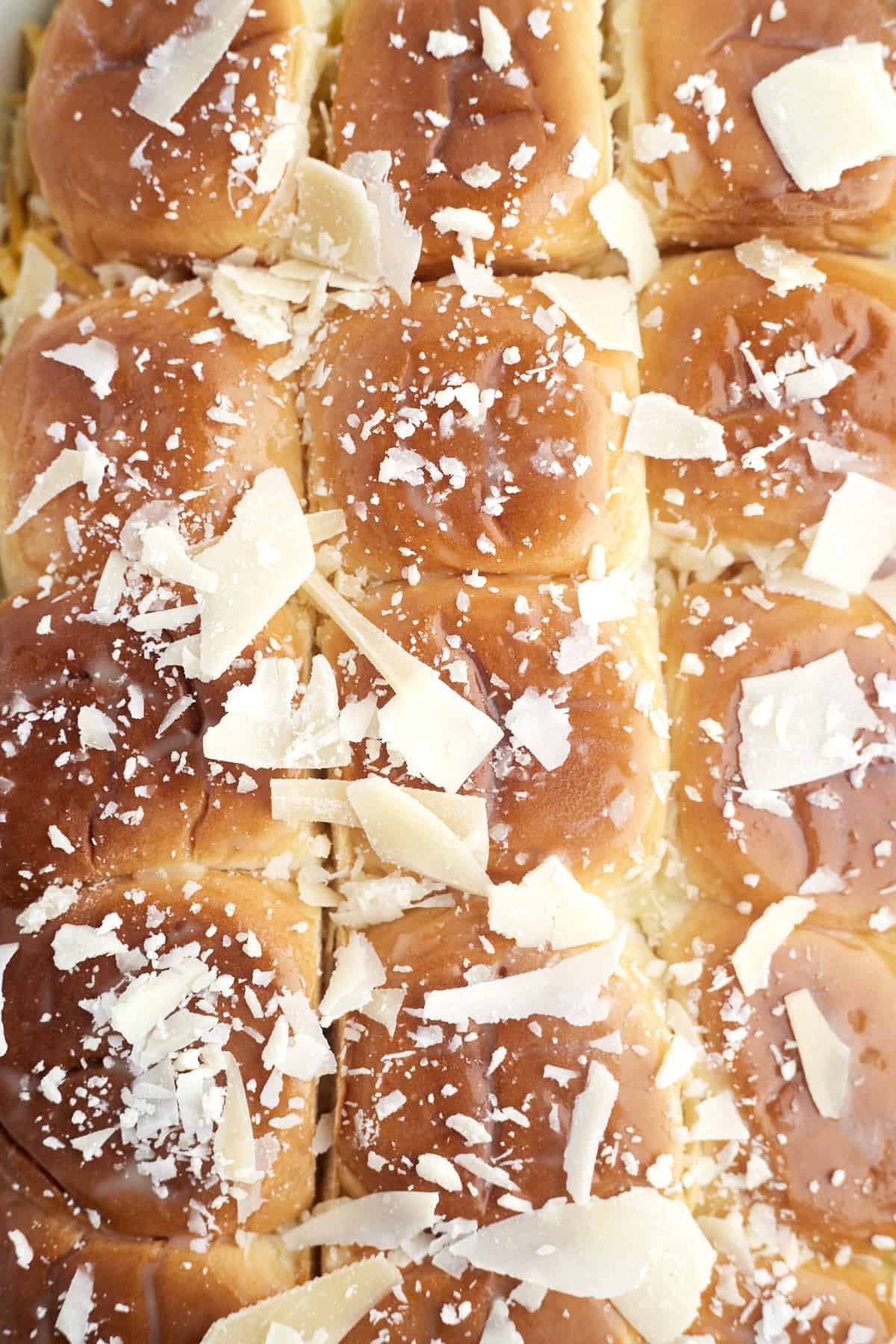 cheesy breakfast brioche sliders topped with Parmesan