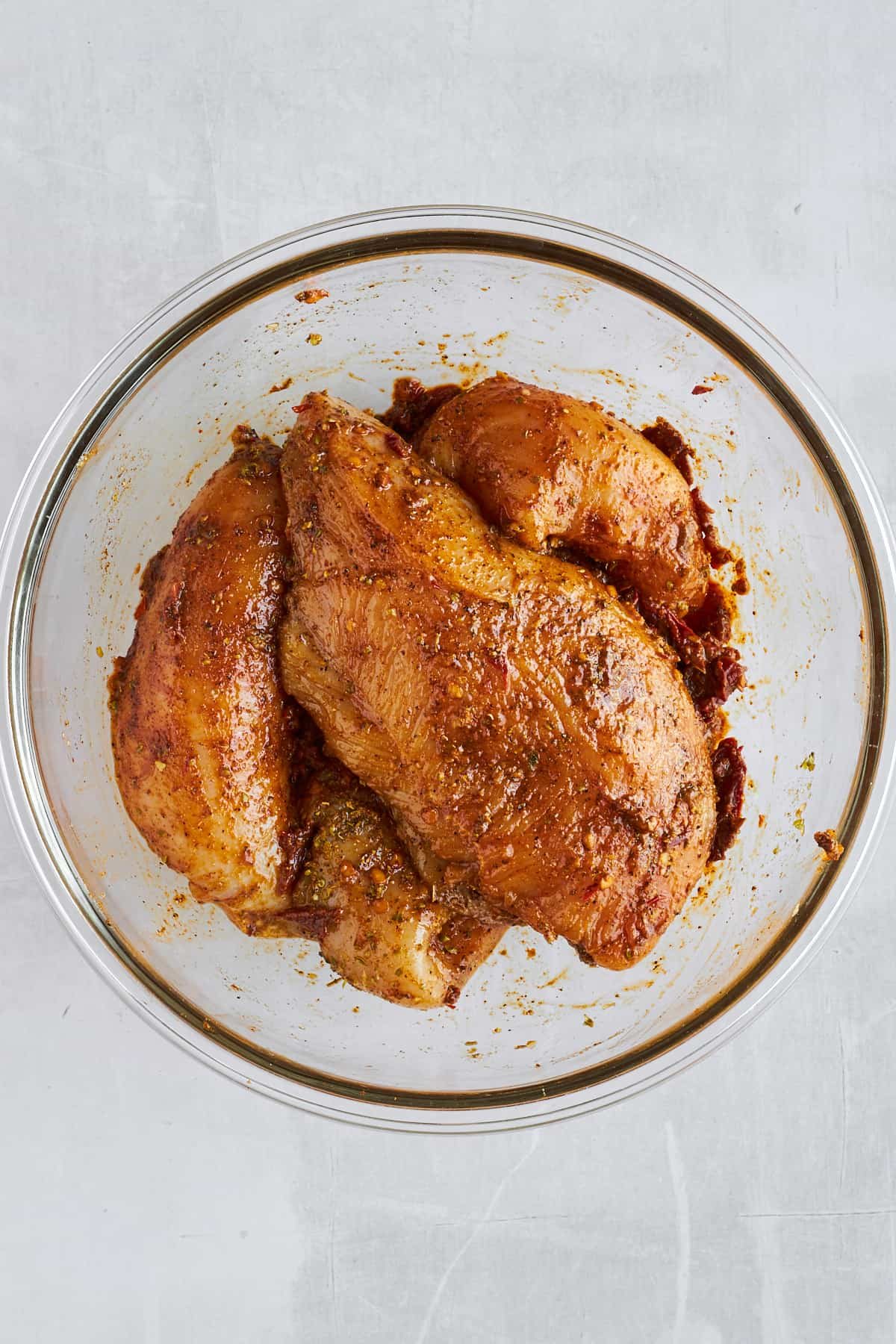 Seasoned raw chipotle chicken thighs.