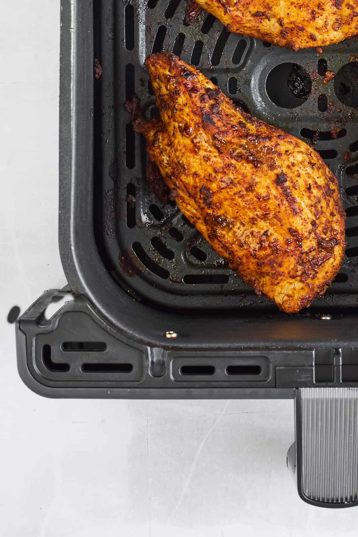 Cooked chipotle chicken in an air fryer.