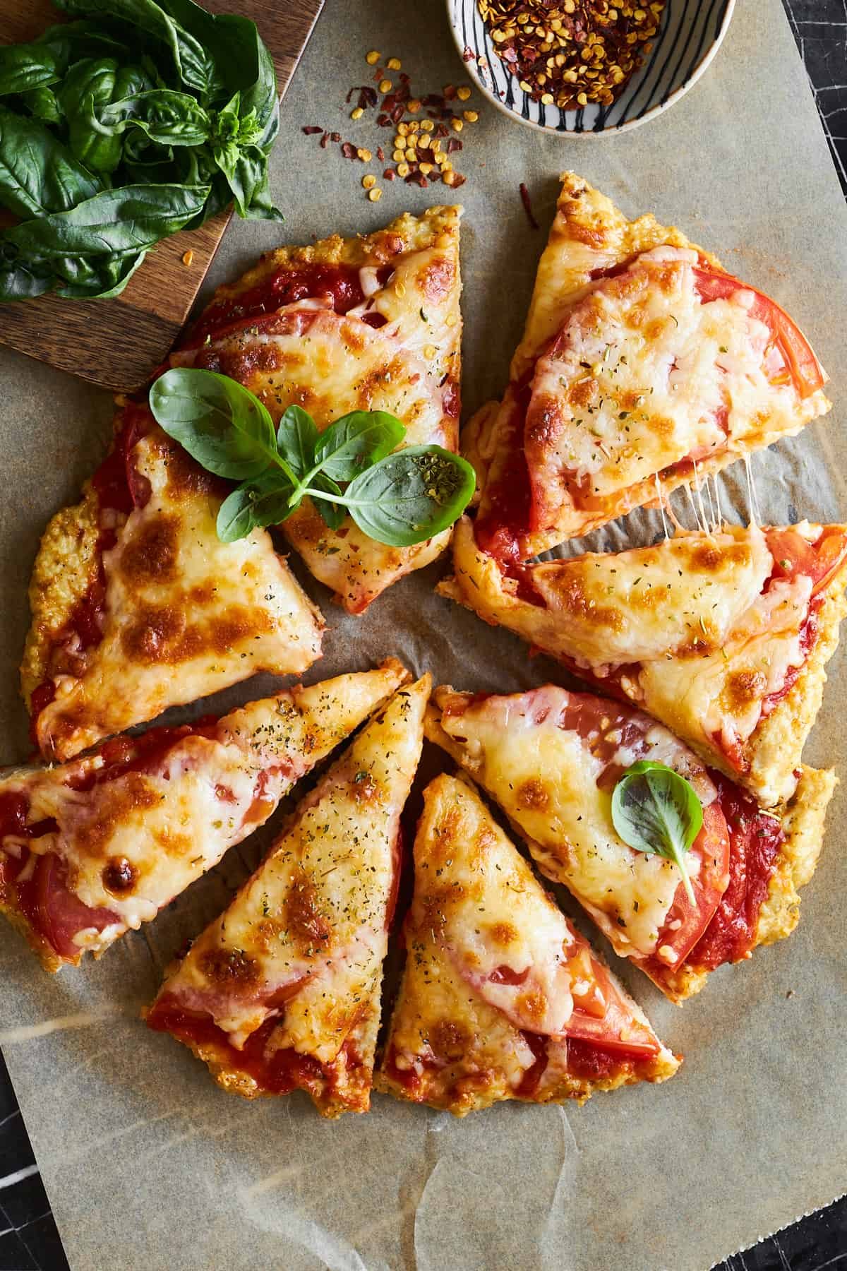 Chicken crust pizza sliced into 8 pieces.
