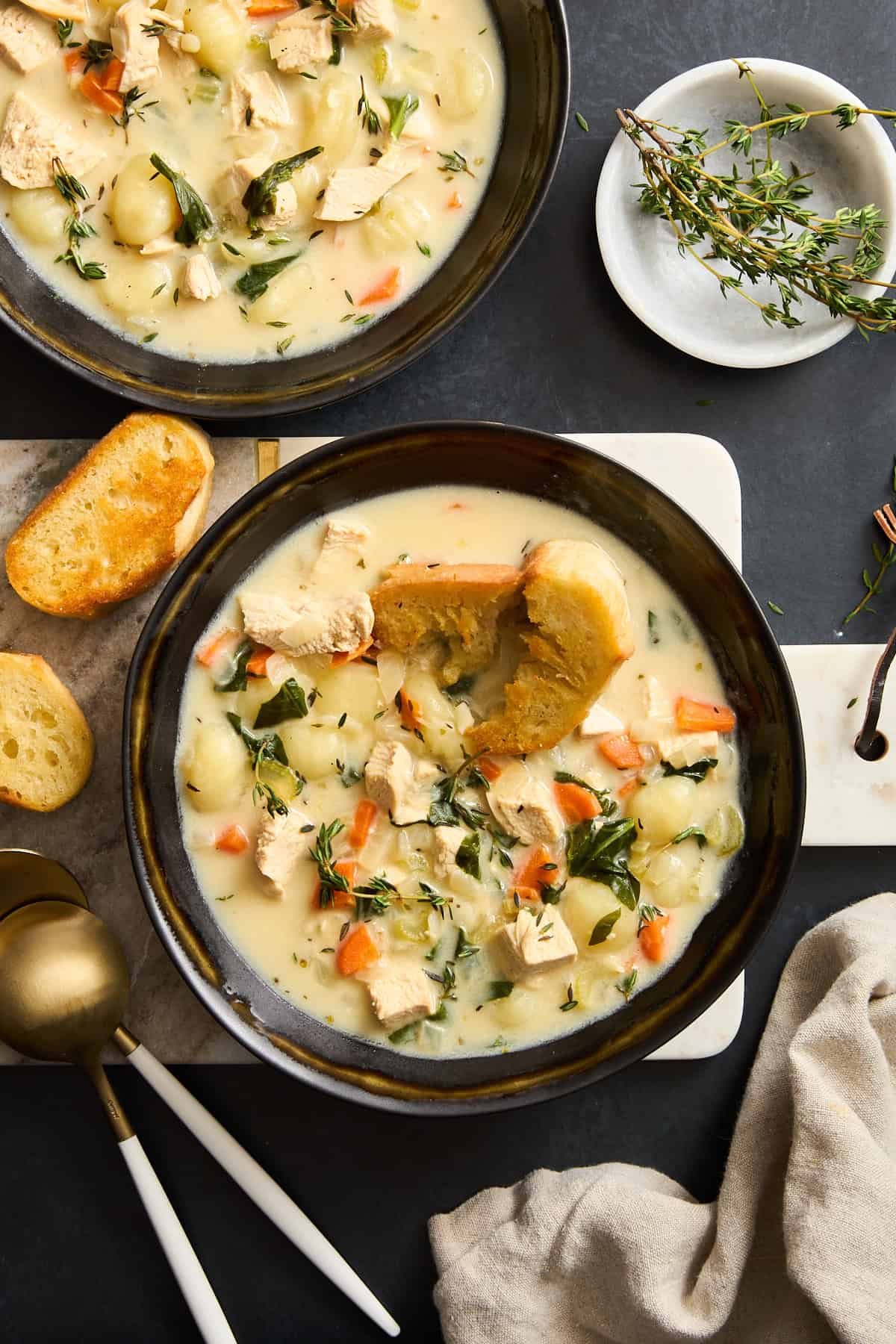Two bowls of copycat Olive Garden chicken gnocchi soup.