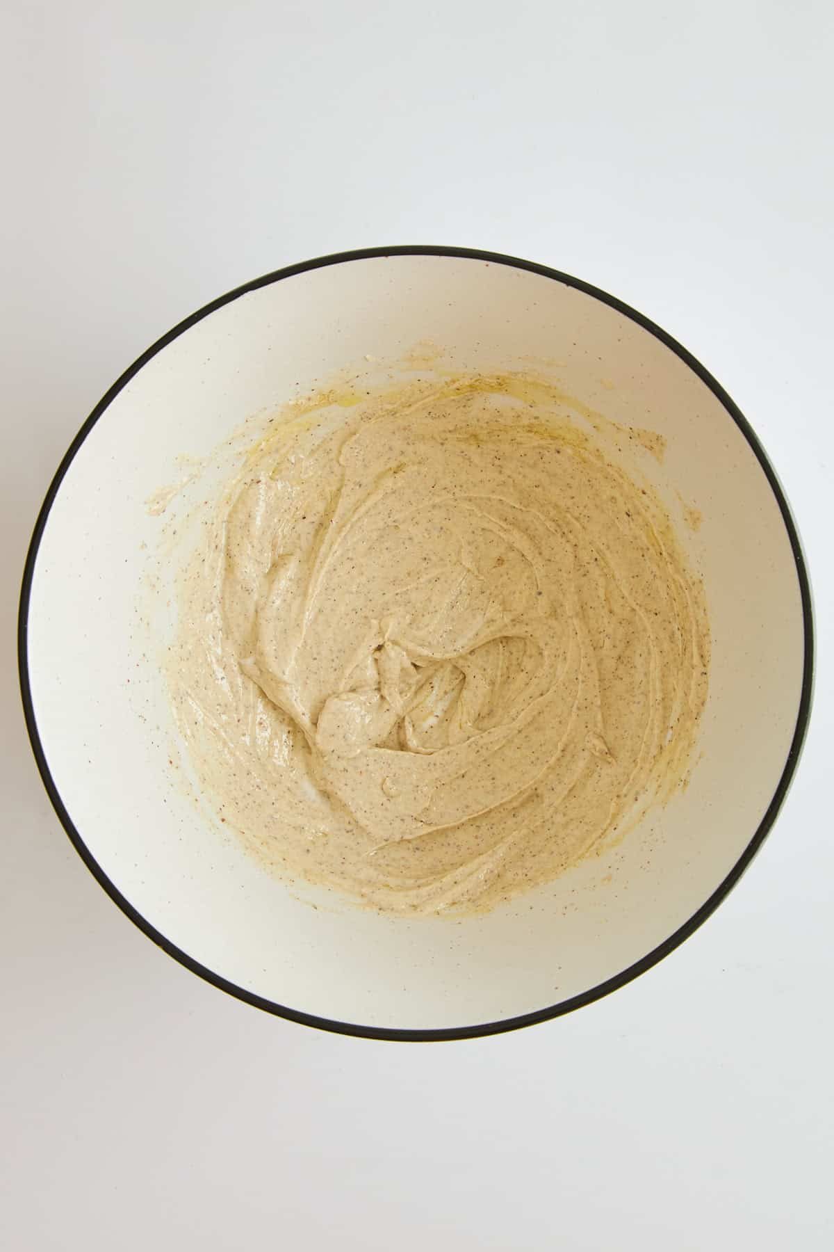 Tahini yogurt chicken marinade in a bowl.