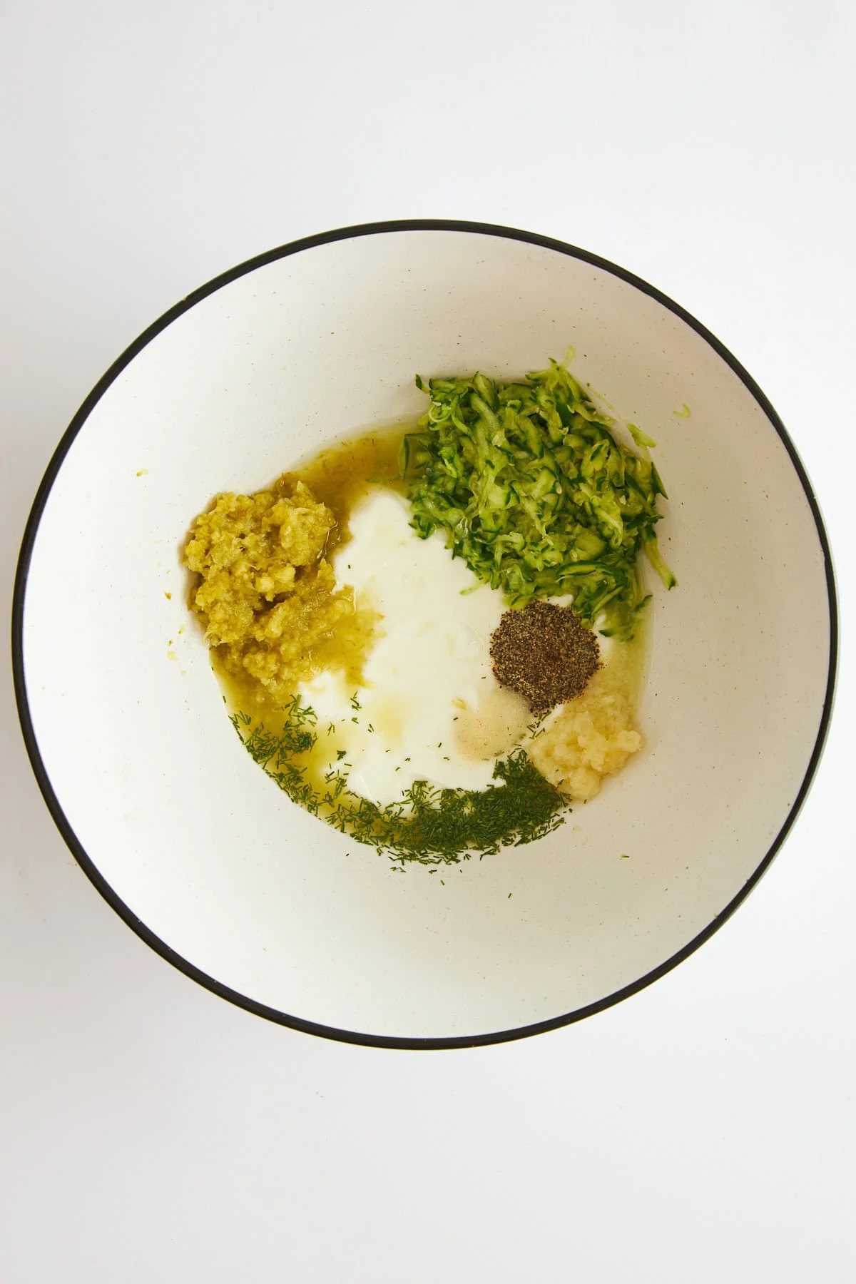 Ingredients for tzatziki chicken marinade in a bowl.