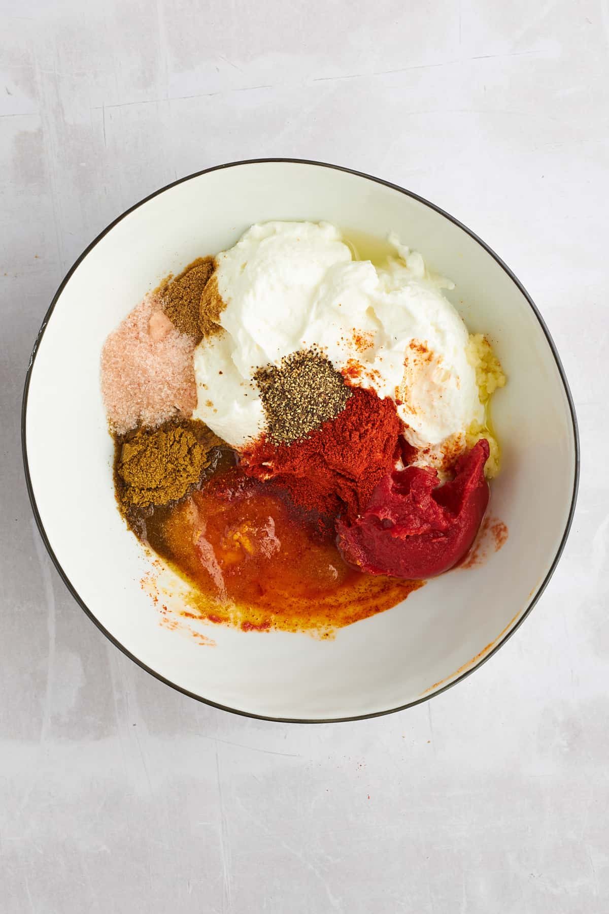 Shawarma marinade ingredients in a bowl.