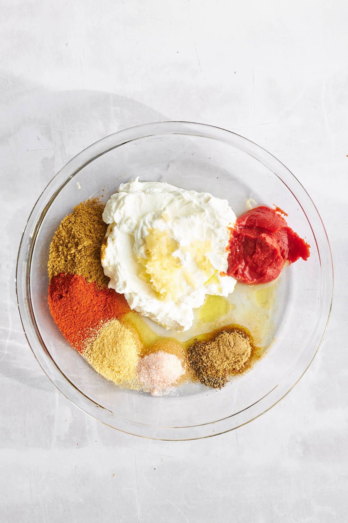 Ingredients for chicken shawarma marinade in a bowl.