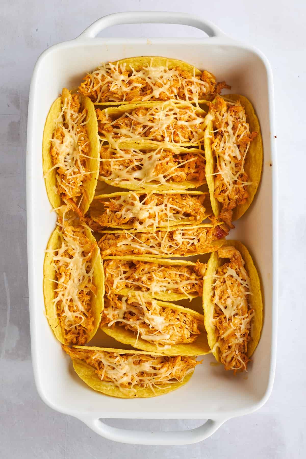 Baked chicken shawarma tacos in a baking dish.