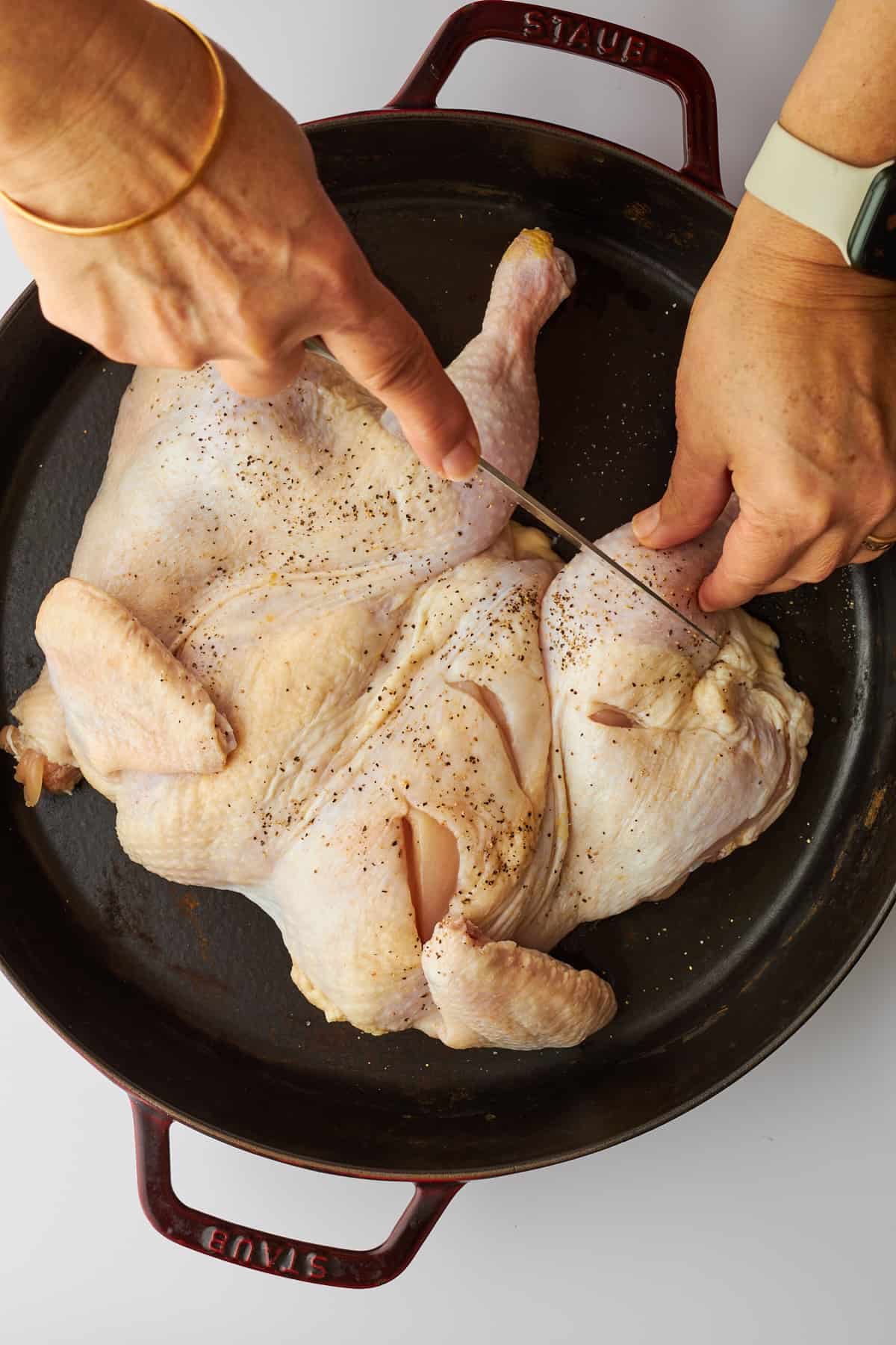 A chicken being spatchcocked.