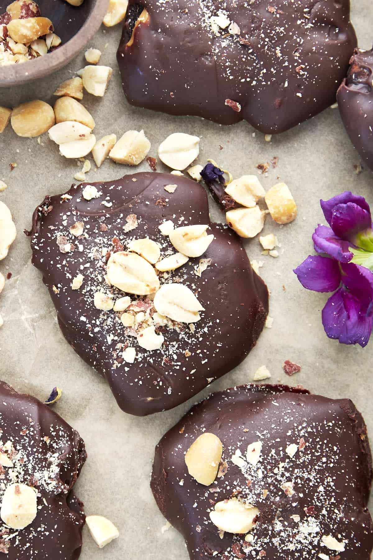 Chocolate Covered Dates with Peanut Butter topped with peanuts.