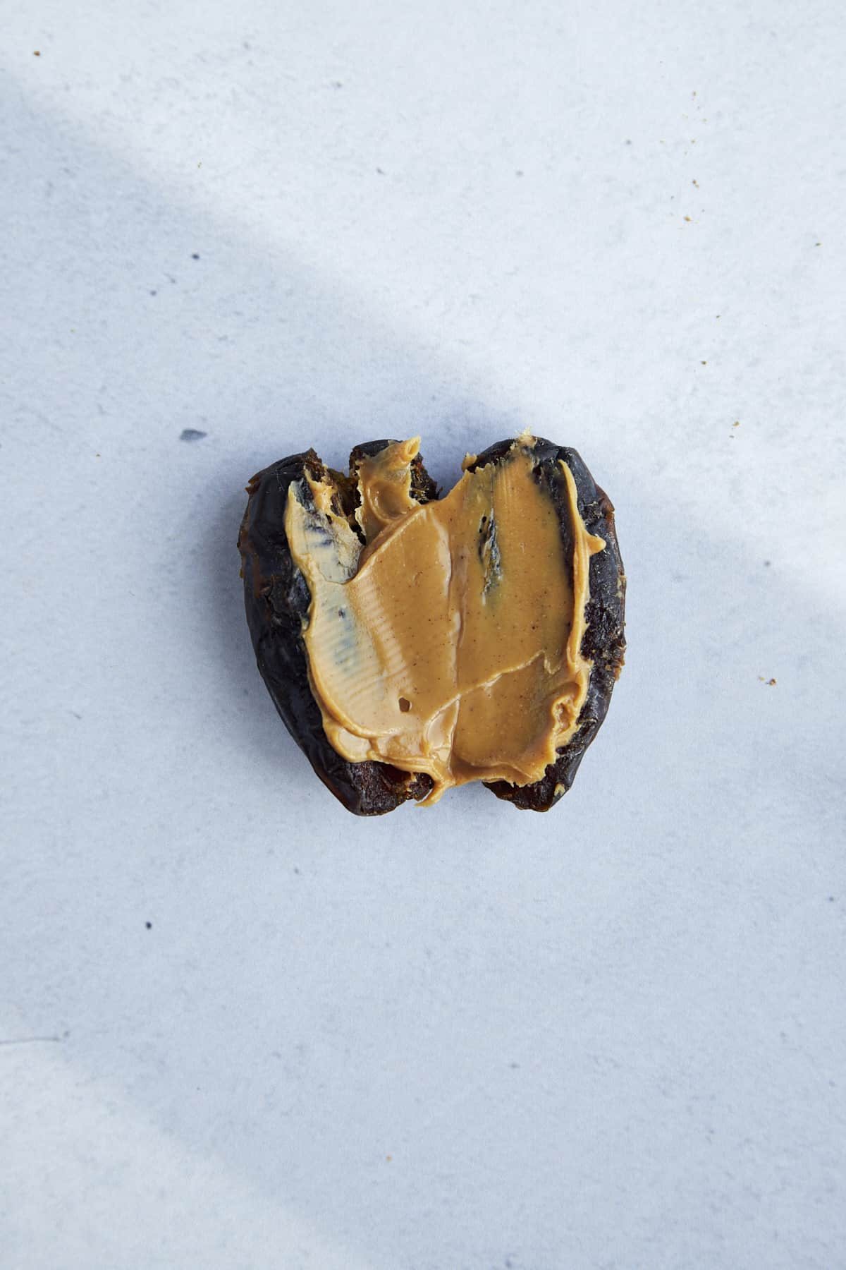 A sliced date stuffed with peanut butter.