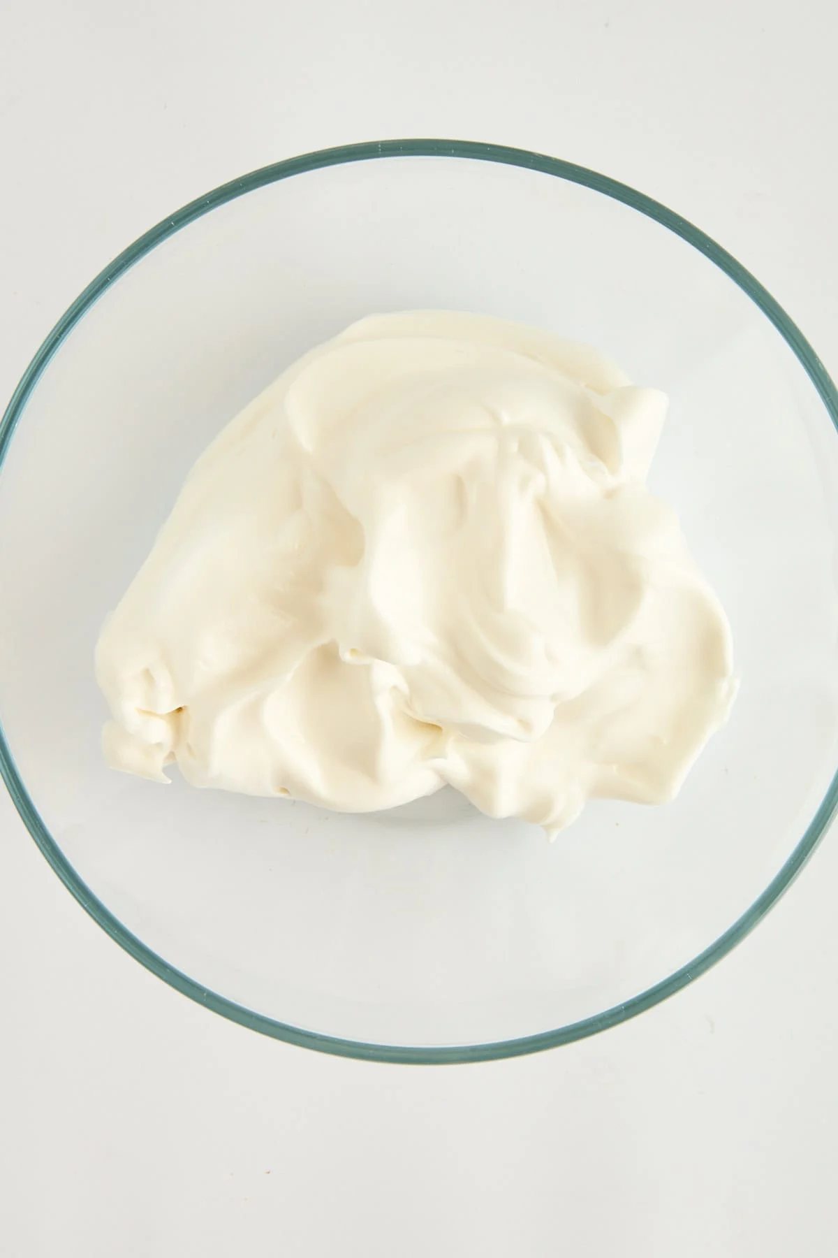 Whipped egg whites in a bowl.