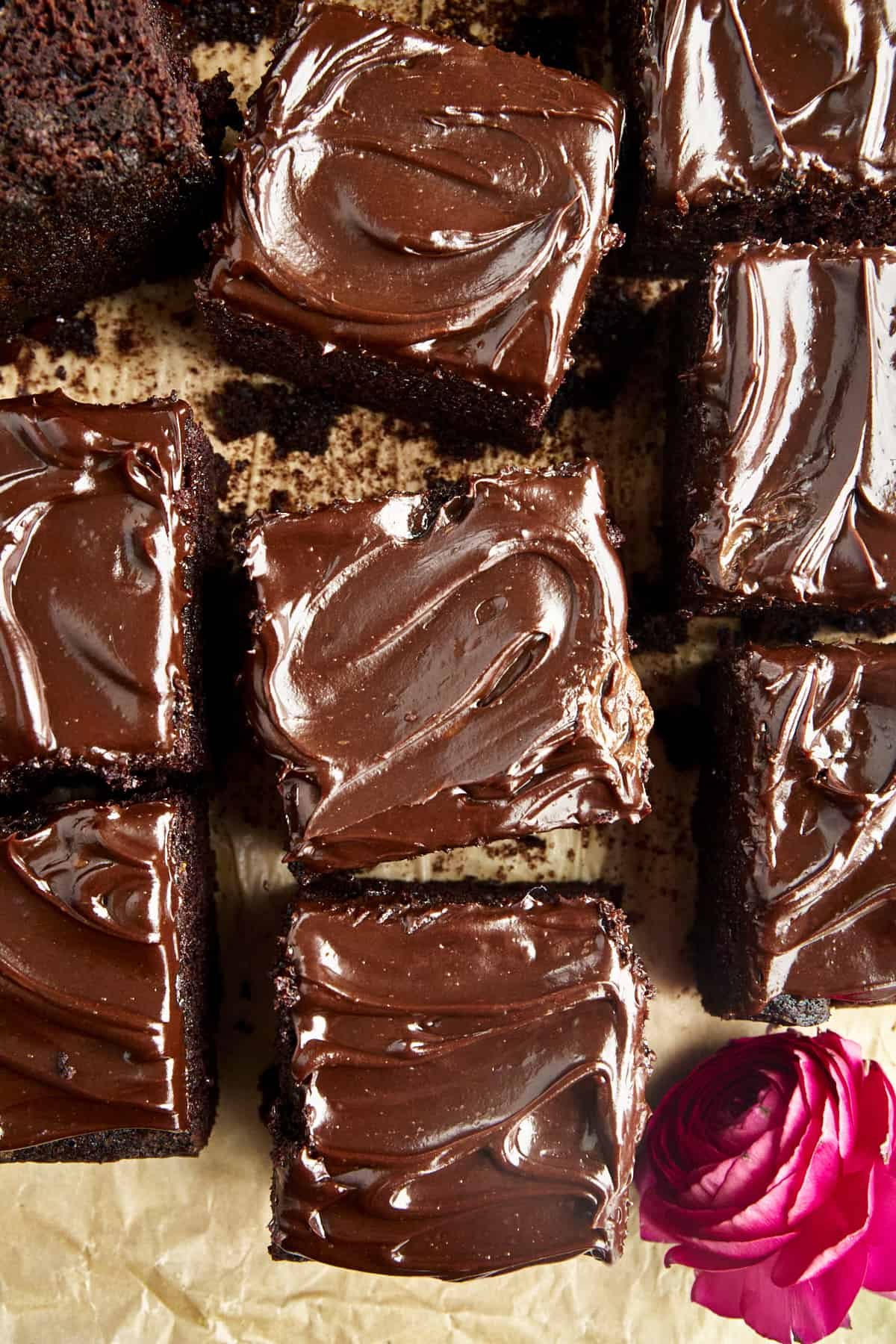 Squares of chocolate frosted chocolate zucchini cake.