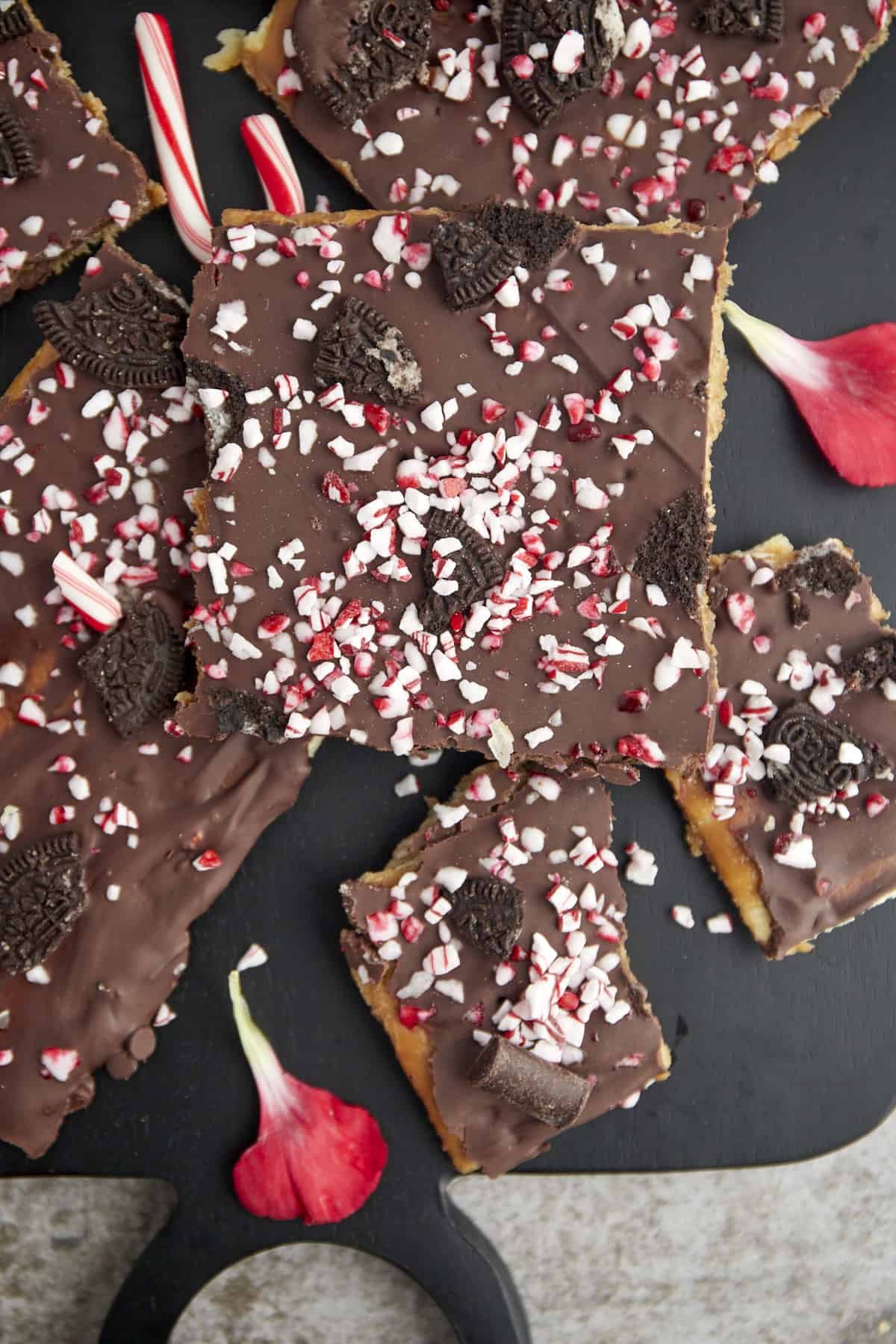 pieces of Christmas crack topped with Oreos and candy canes