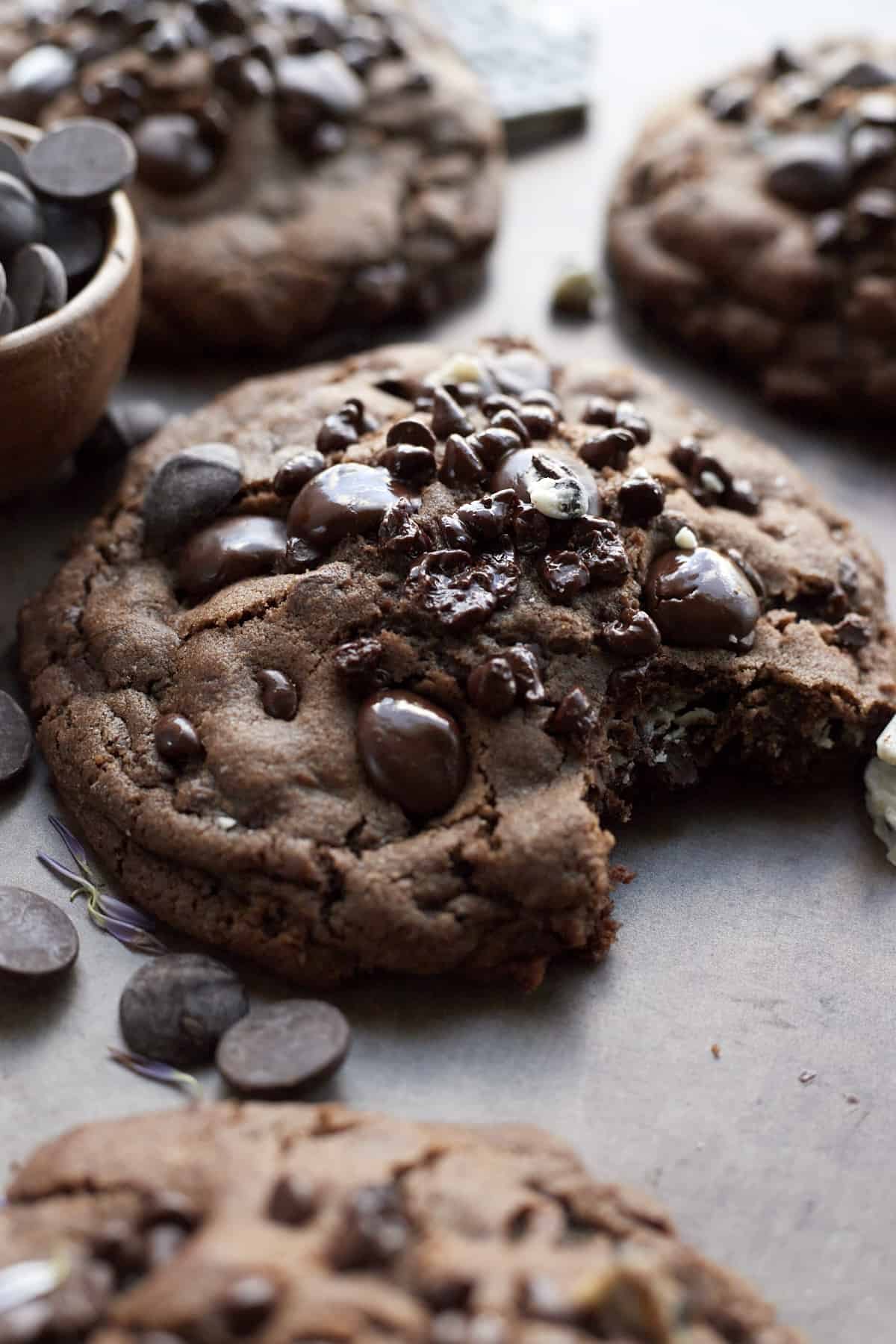 close up image of a cookies 'n cream double chocolate chip cookie with a bite taken out.