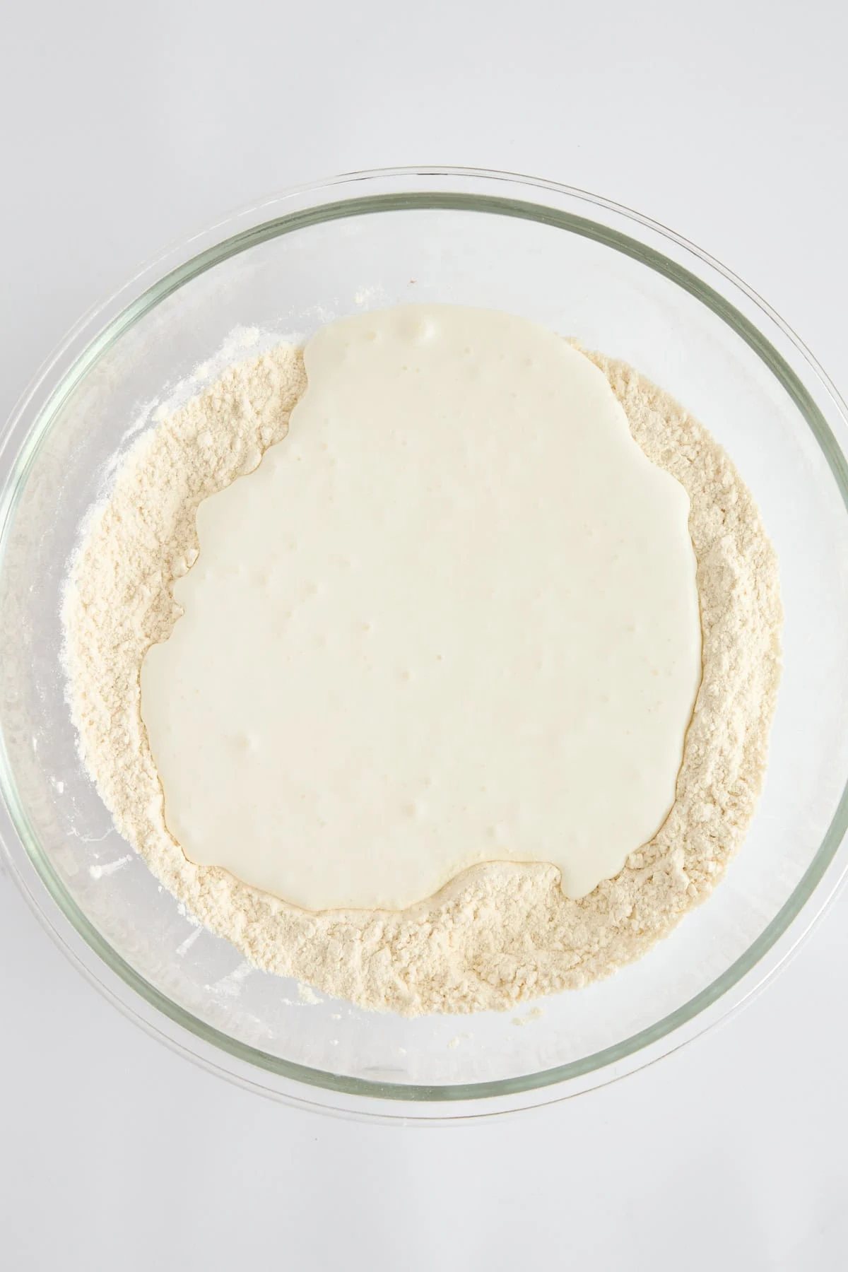 Flour and cottage cheese in a bowl.