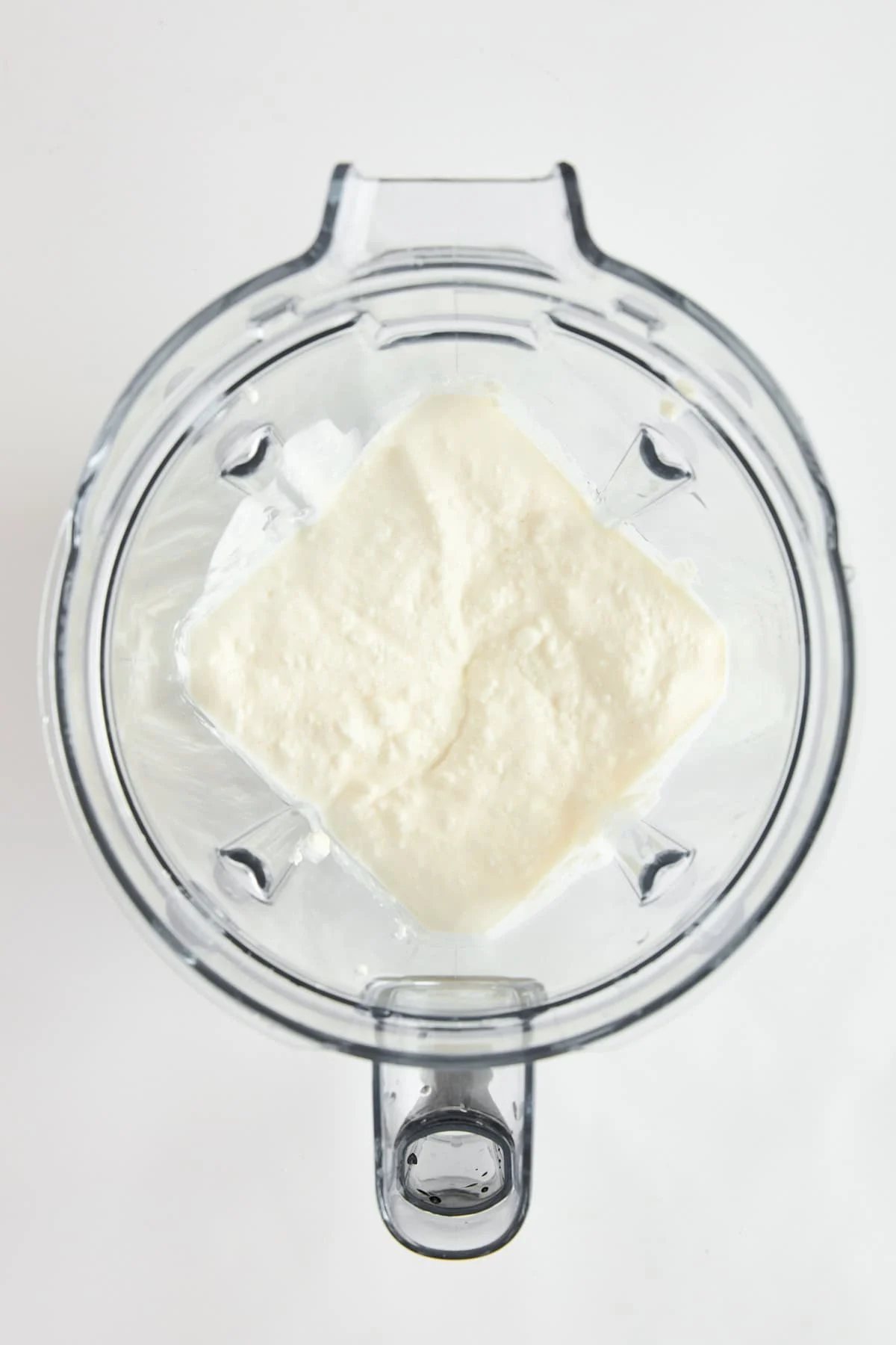 Blended cottage cheese in a blender.