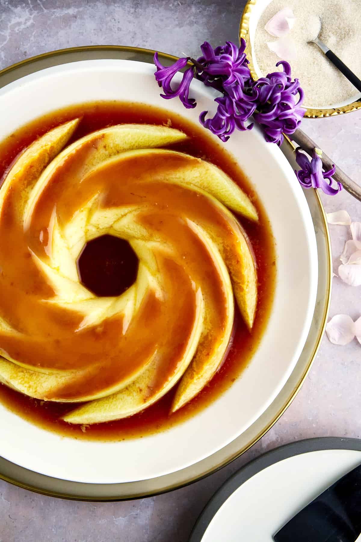 A creme caramel flan recipe on a plate.