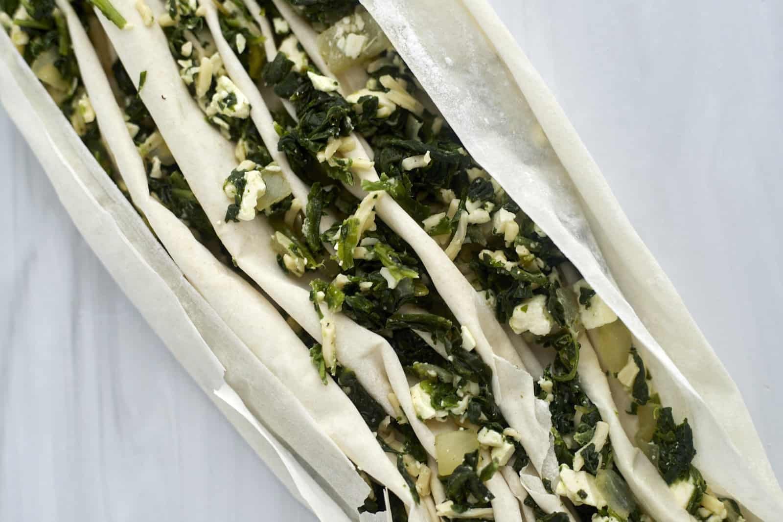 Cheese and spinach stuffed crinkle phyllo dough.