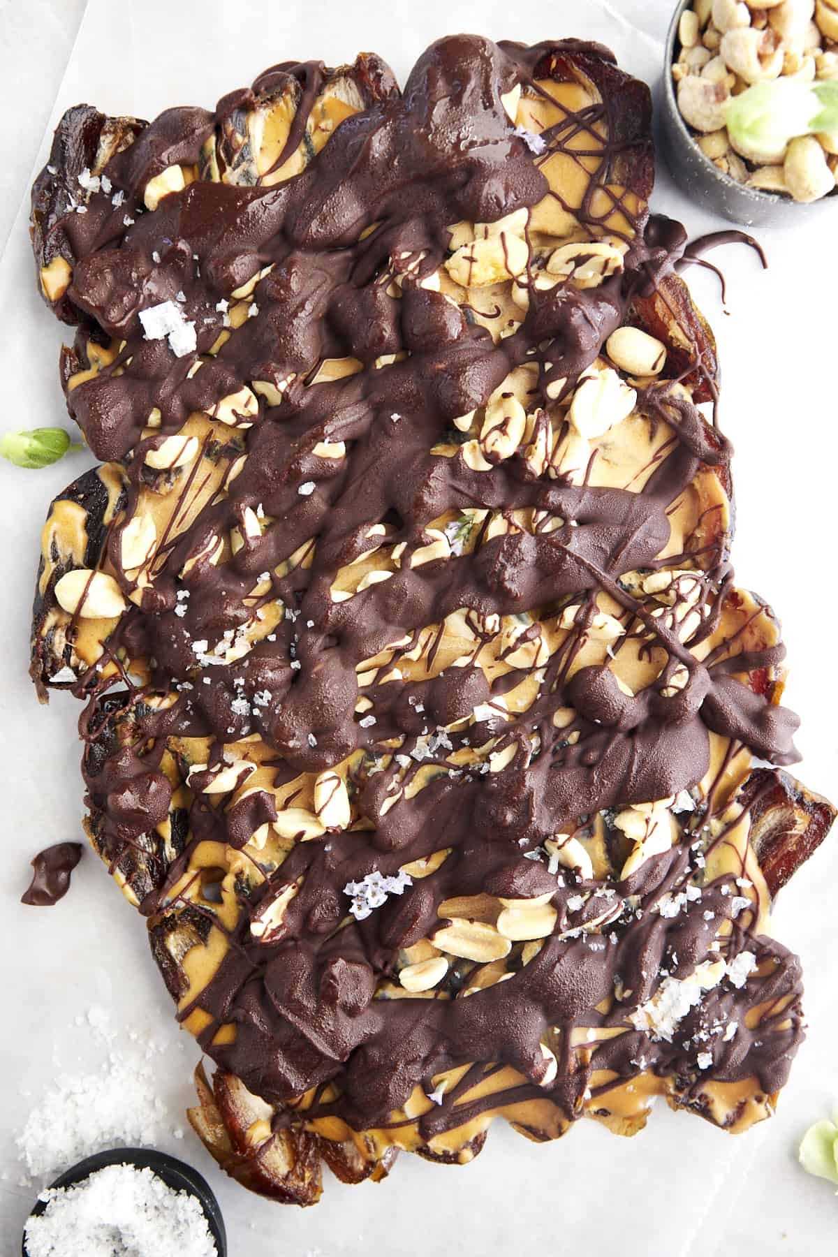A slab of Snickers date bark topped with sea salt.