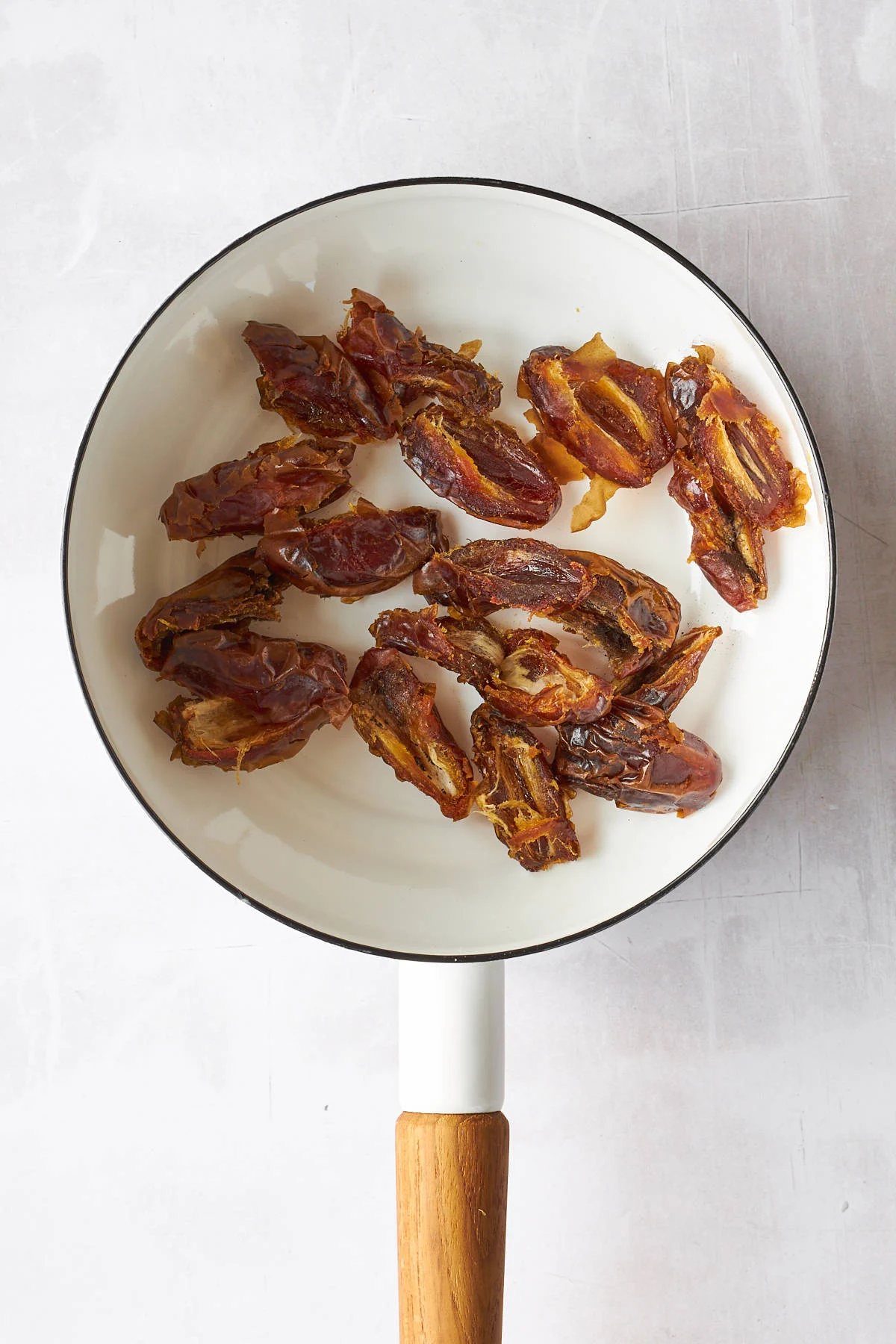 Halved dates in a pot.
