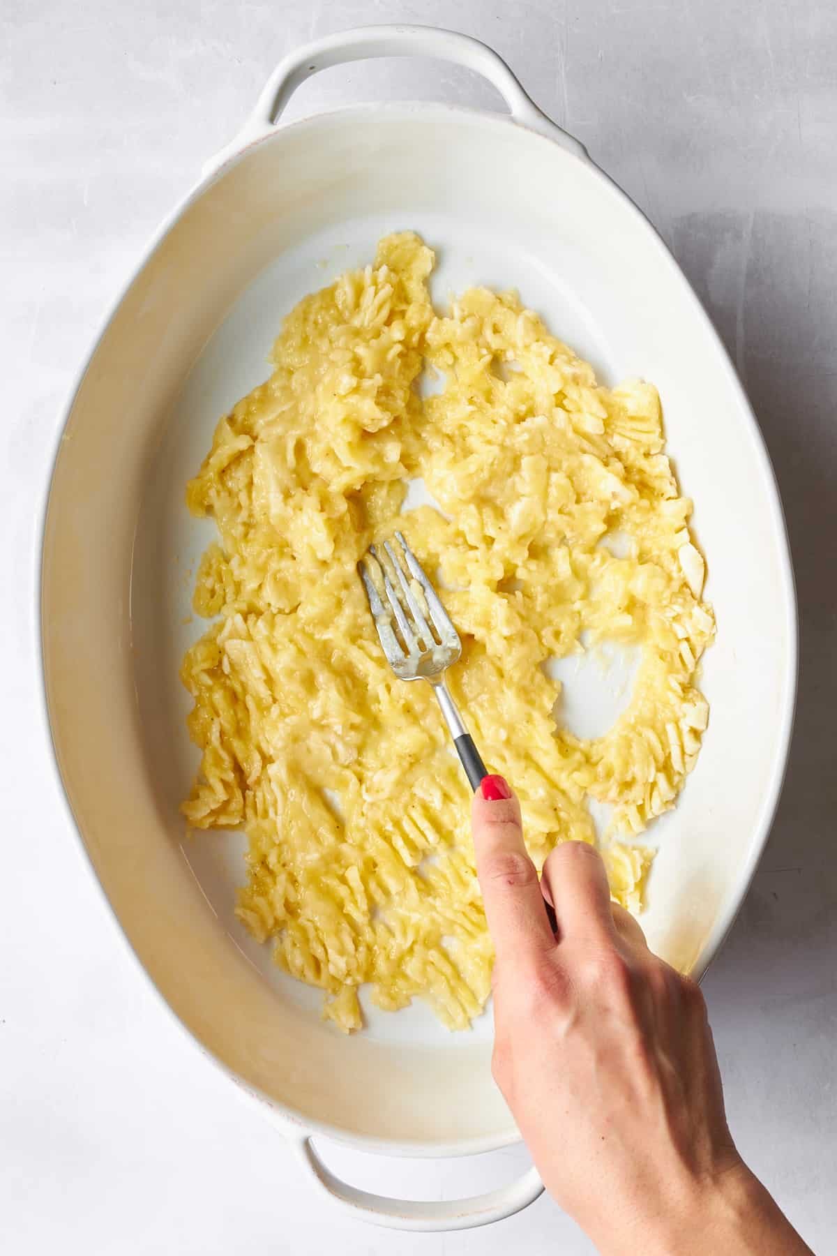 Mashed bananas in a baking dish.