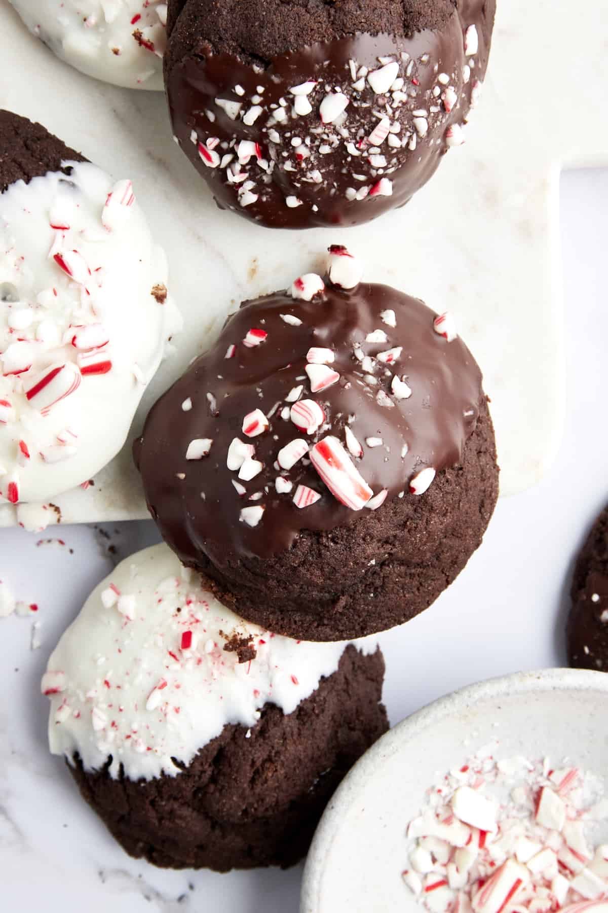 Chocolate peppermint cookies dipped in white and dark chocolate topped with candy canes.
